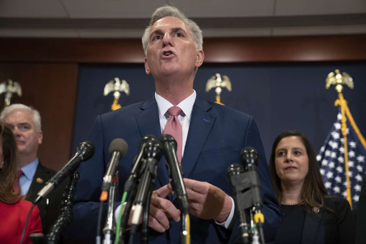 House Minority Leader Kevin McCarthy, of Calif., talks the media, Tuesday after voting on top House Republican leadership positions, on Capitol Hill in Washington. Rep. Elise Stefanik, R-N.Y., is at right.