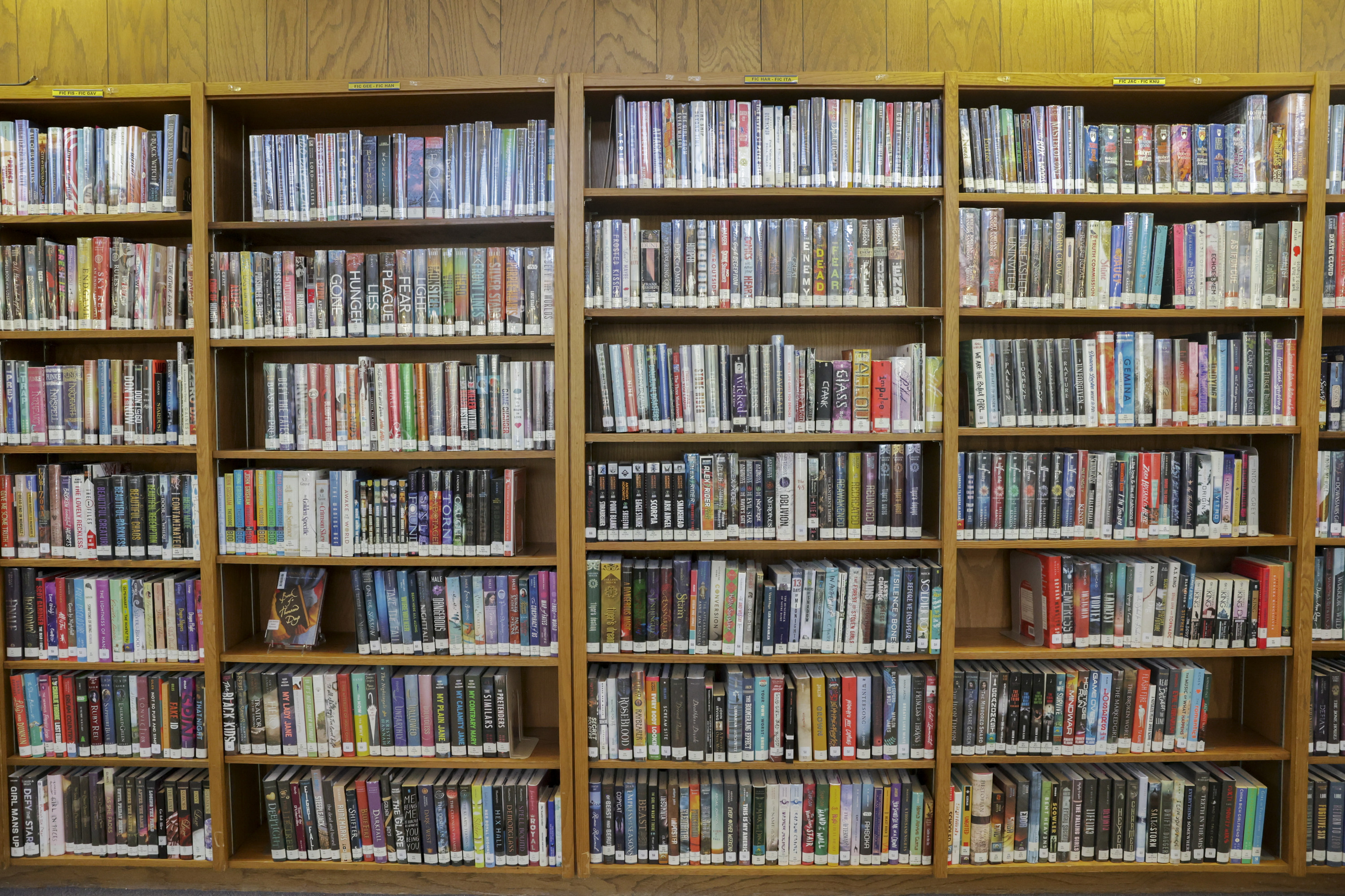 A collection of fiction books are pictured at the library at Skyline High School in Salt Lake City, May 10. Several school district representatives who spoke during the Utah Legislature's Education Interim Committee meeting Wednesday said that the implementation of HB374 is going less than smoothly and causing problems in their districts.
