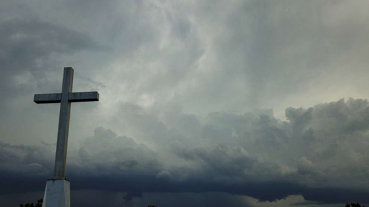 Storm clouds approach a church in Mequon, Wis., on Aug. 2, 2020. A new Pew Research Center report published Thursday explores how religion in the U.S. intersects with views on the environment and climate change.