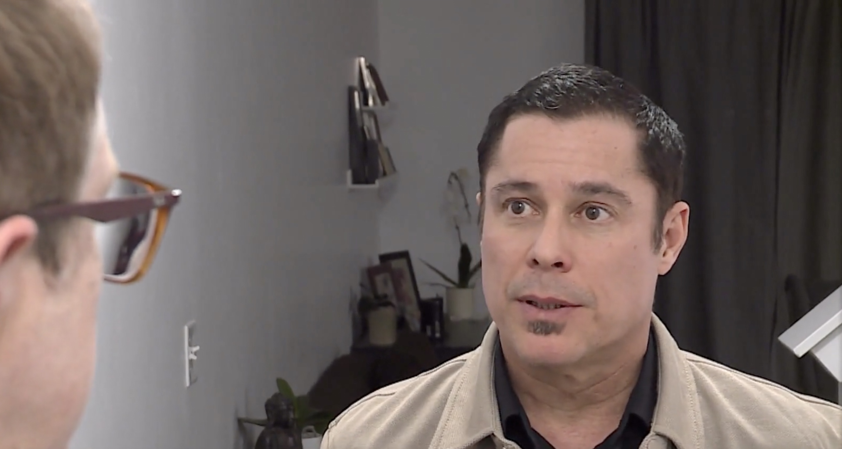 A gunshot fired through the wall of a townhome into Noel Mendez's home on Wednesday led officers to arrest the neighbor, following the discovery of greater destruction inside that man’s home next door.