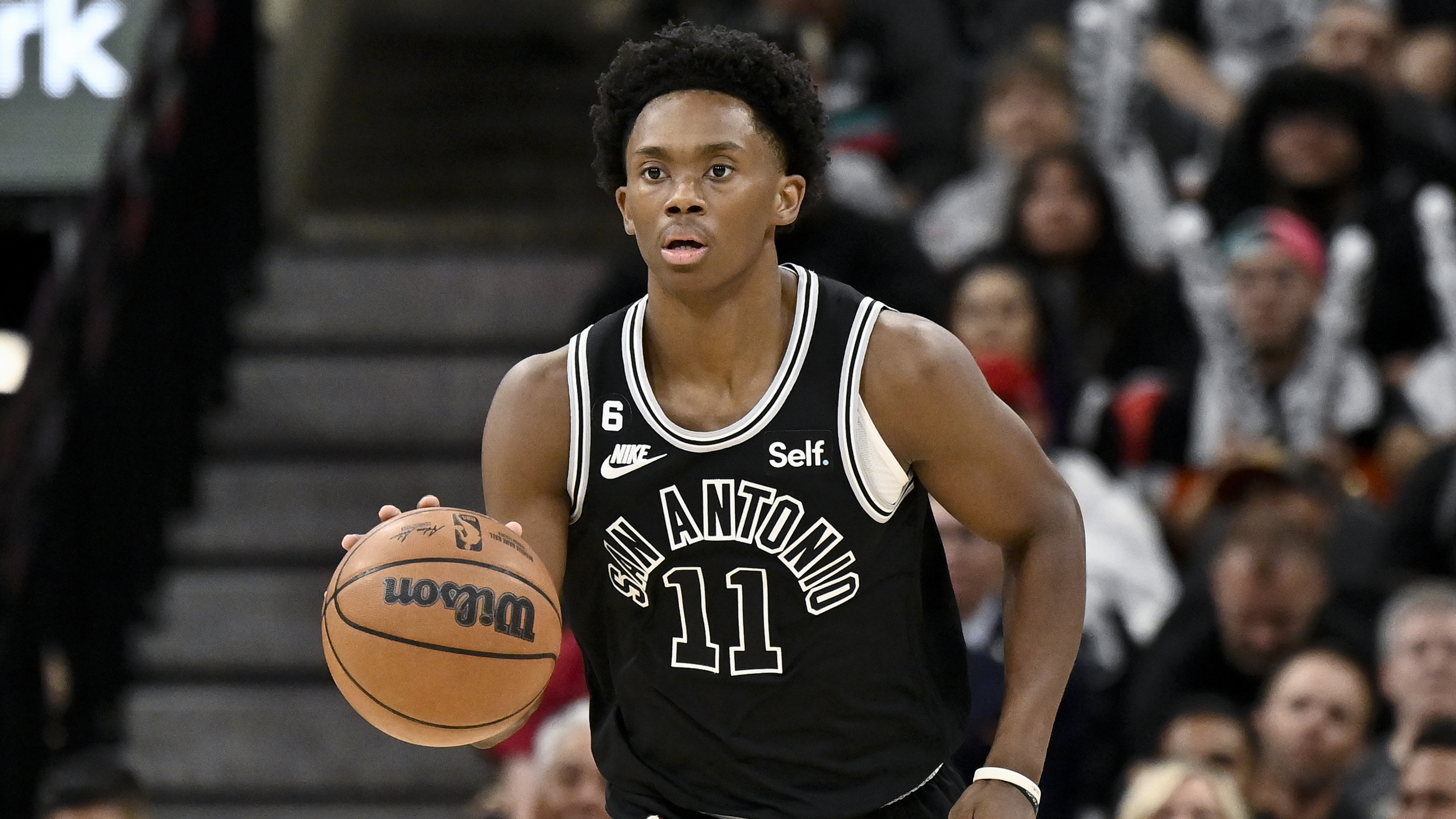 FILE San Antonio Spurs' Josh Primo dribbles up the court during the second half of an NBA basketball game against the Charlotte Hornets, on Oct. 19, 2022, in San Antonio. Dr. Hillary Cauthen, a psychologist who worked for the Spurs has settled her lawsuit against the team and former player Josh Primo over allegations he had exposed himself to her multiple times in private sessions, her attorney said Thursday, Nov. 17, 2022.