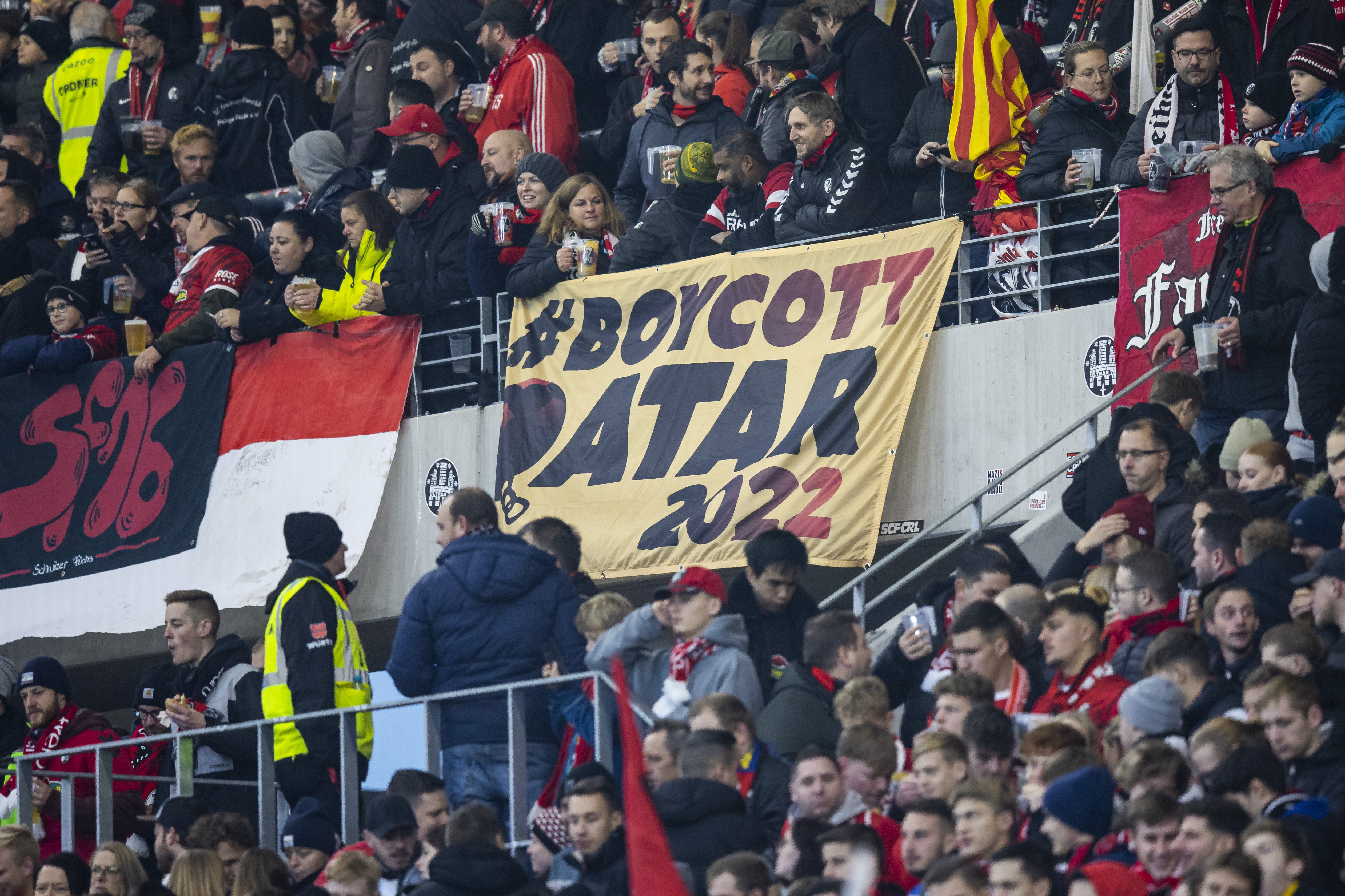 A placard with the inscription "Boycott Qatar 2022" can be seen in the SC Freiburg fan block before the Bundesliga soccer match between Freiburg and FC Union Berlin at Europa-Park Stadion in Freiburg im Breisgau, Germany, Sunday, Nov. 13, 2022. . 