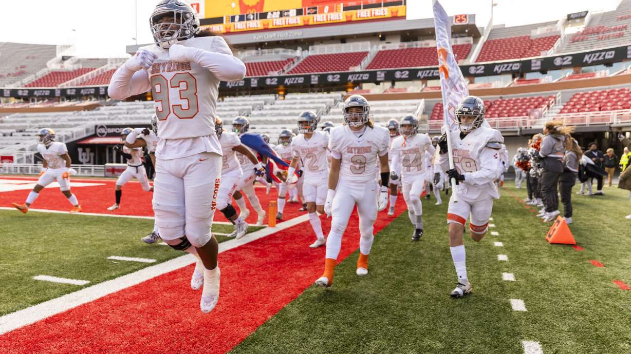 Skyridge Falcons fans cheer as their team plays the Corner Canyon Chargers in the 6A state football championship at Rice-Eccles Stadium at the University of Utah in Salt Lake City on Friday, Nov. 18, 2022. The Falcons won 17-10.