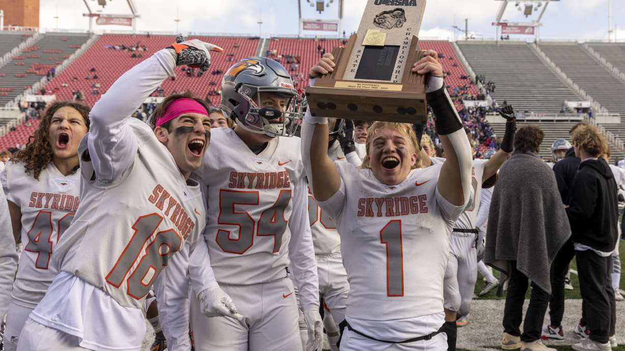 The Skyridge Falcons celebrate after beating the Canyon Chargers in the 6A state football championship at Rice-Eccles Stadium at the University of Utah in Salt Lake City on Friday, Nov. 18, 2022. The Falcons won 17-7.