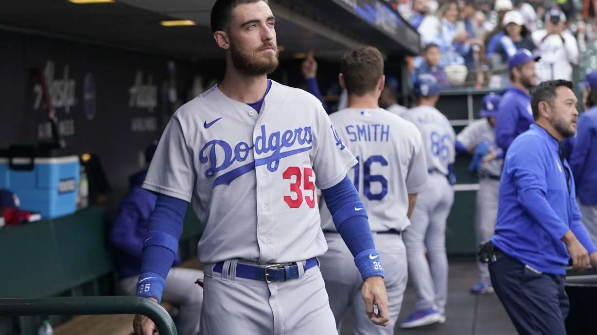 FILE - Los Angeles Dodgers' Cody Bellinger stands in the dugout before the team's baseball game against the San Francisco Giants in San Francisco, Aug. 2, 2022. The Dodgers didn't tender Bellinger a contract on Friday, Nov. 18, making the 2019 National League MVP a free agent.