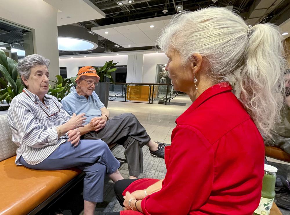 Roz and Nelson Hyman, left, talk with their friend Elizabeth Grove at a shopping complex in Towson, Md., Sept. 18. The Hymans are Democrats who say President Joe Biden’s age, 80 on Sunday, isn’t a concern for them if he decides to run for another term. The oldest president in U.S. history has a record as a campaign winner and has posted major legislative successes in recent months. But surveys of voters point to concern about his capabilities.