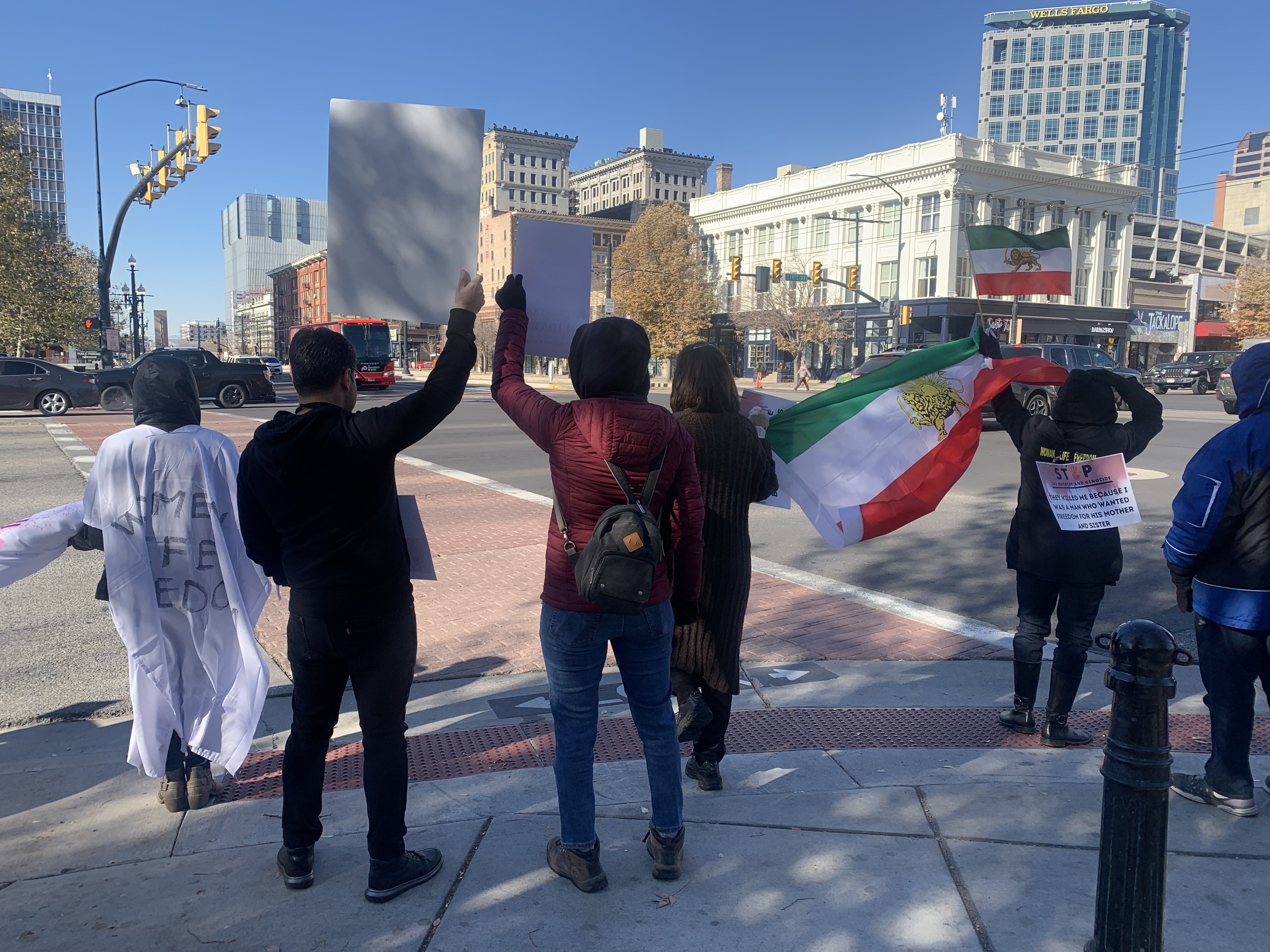 A group of close to 100 Iranians and others in Salt Lake City joined protests around the world in solidarity with protesters in Iran on Saturday.
