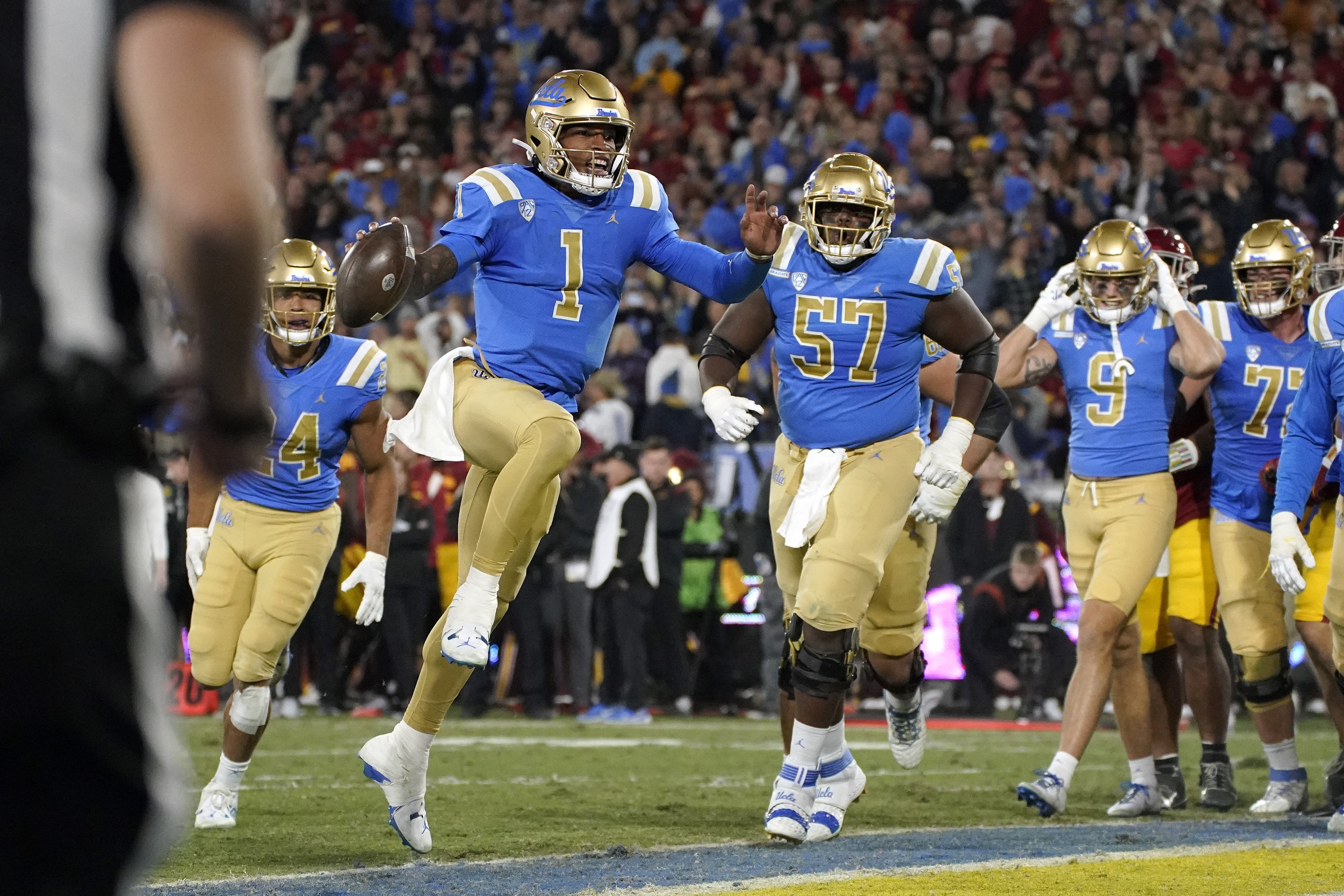 UCLA quarterback Dorian Thompson-Robinson (1) celebrates as he scores a touchdown during the first half of an NCAA college football game against Southern California Saturday, Nov. 19, 2022, in Pasadena, Calif. 