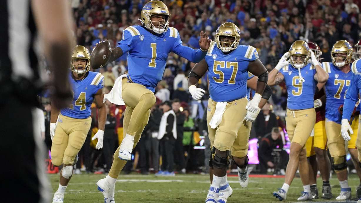 UCLA quarterback Dorian Thompson-Robinson (1) celebrates as he scores a touchdown during the first half of an NCAA college football game against Southern California Saturday, Nov. 19, 2022, in Pasadena, Calif.