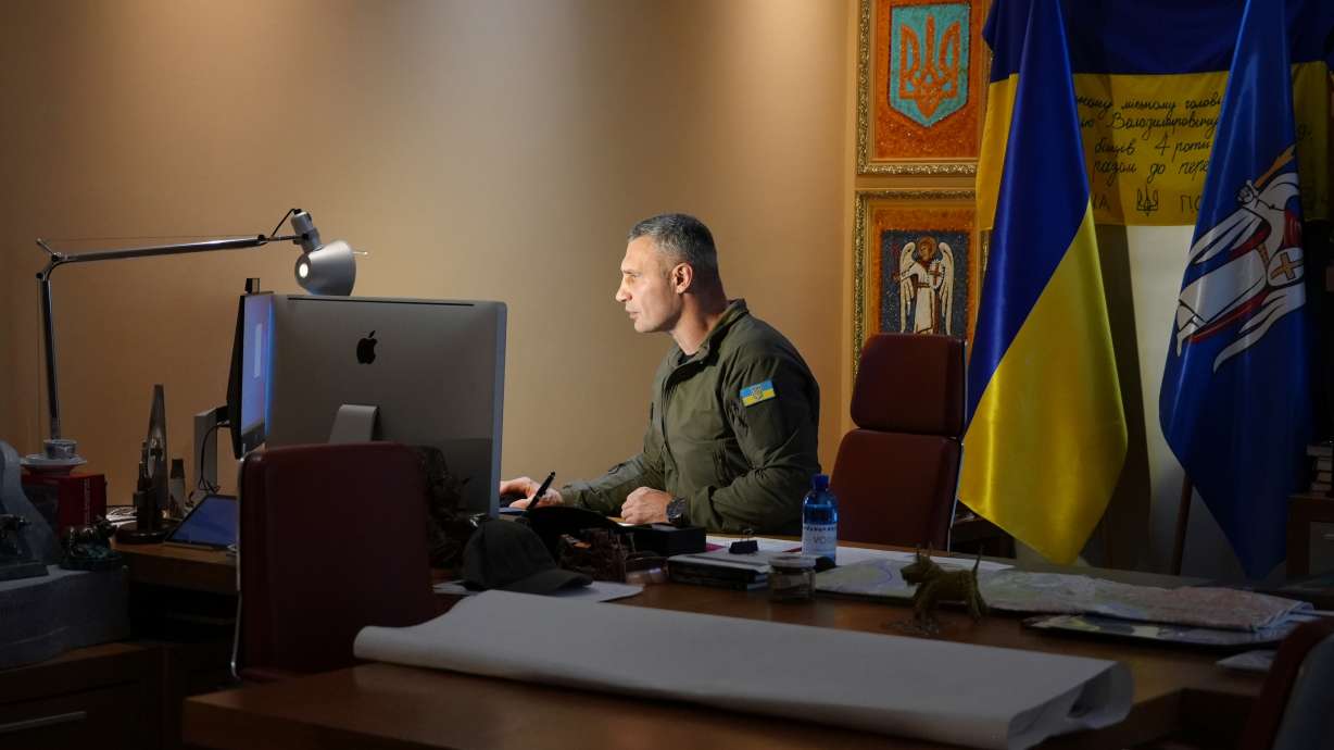 Kyiv Mayor Vitali Klitschko works at his desk in his City Hall office in the Ukrainian capital, Friday, Nov. 18, 2022. Once a boxing champion, Kyiv's mayor is up against a challenge bigger than any he faced in the ring: Keeping Ukraine’s war-time capital functioning. Vitali Klitschko spoke to The Associated Press in his City Hall office.