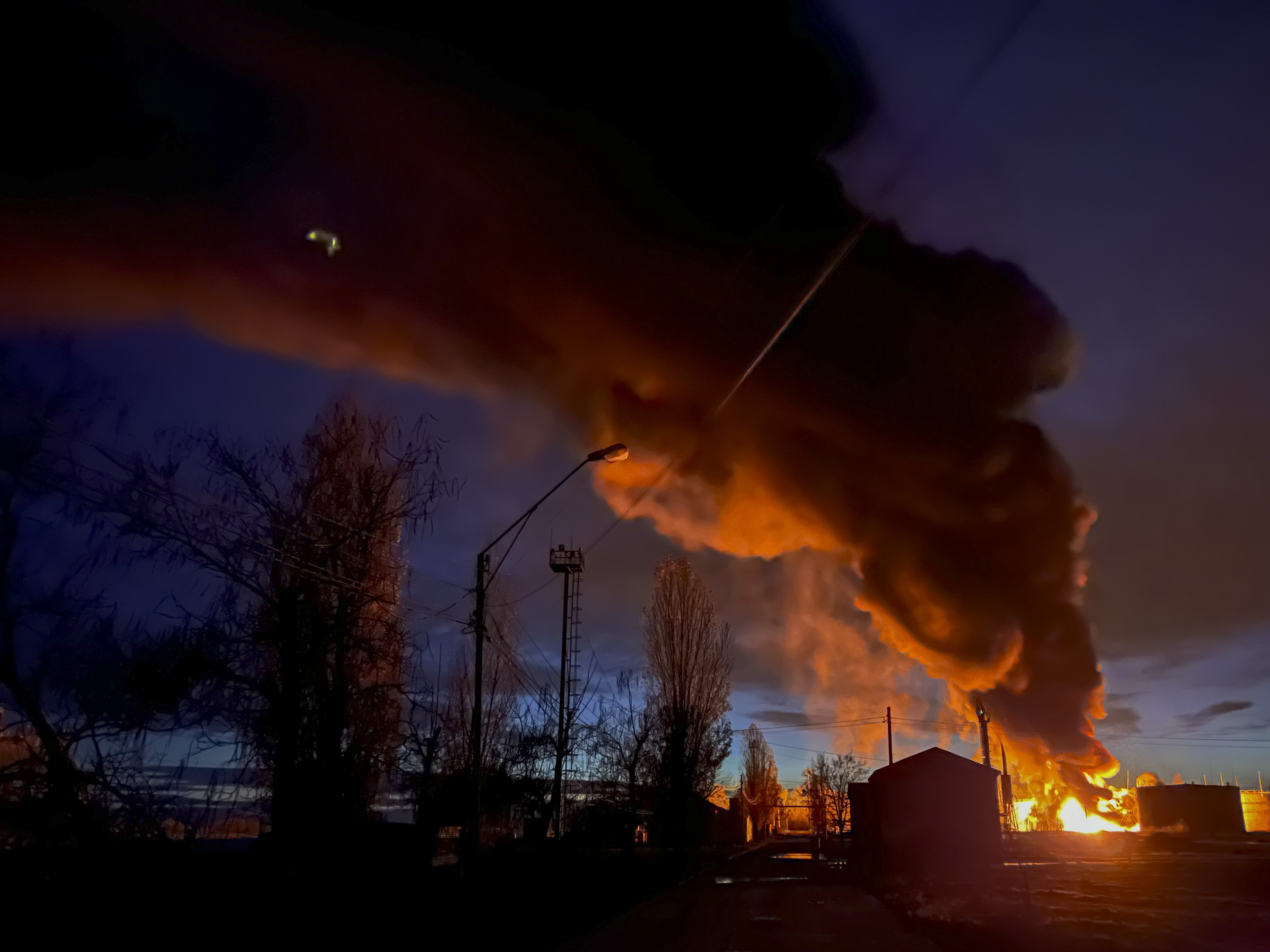 A plume of smoke rises during a fire caused by a Russian attack in Kherson, southern Ukraine, Saturday.