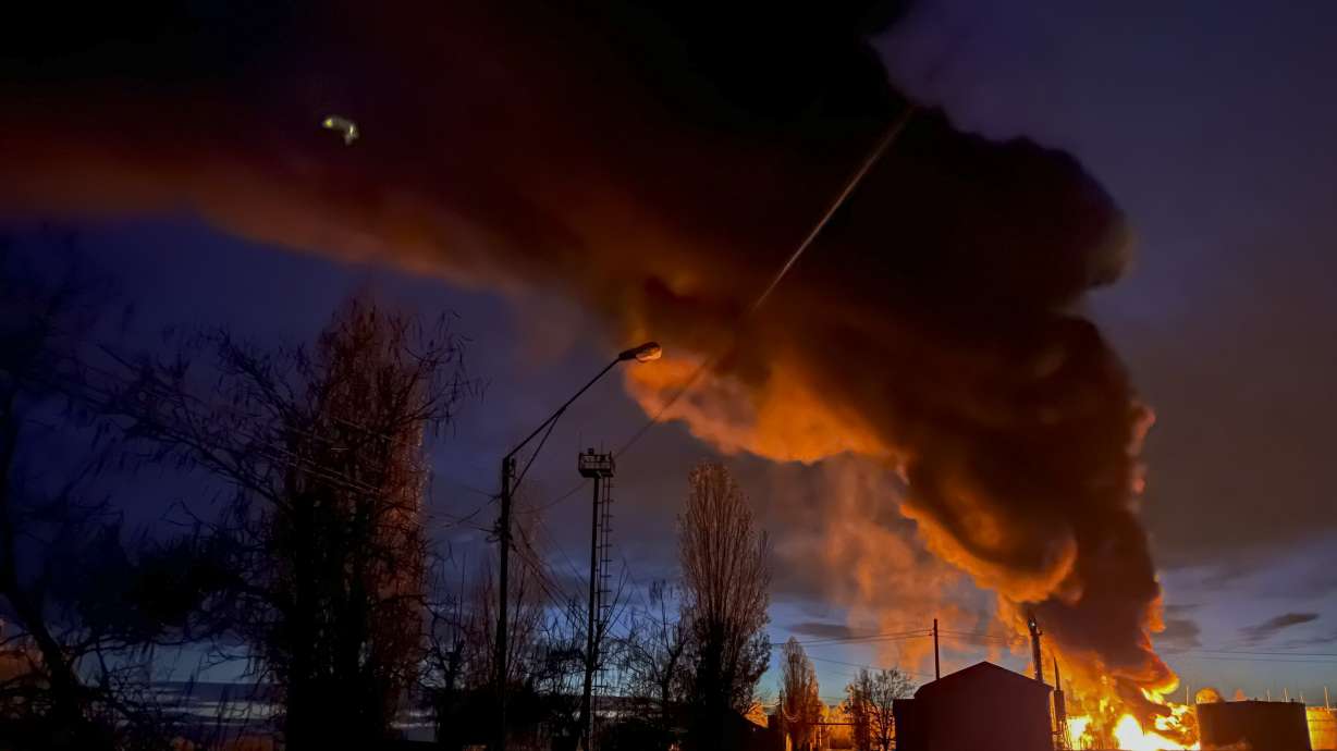 A plume of smoke rises during a fire caused by a Russian attack in Kherson, southern Ukraine, Saturday.