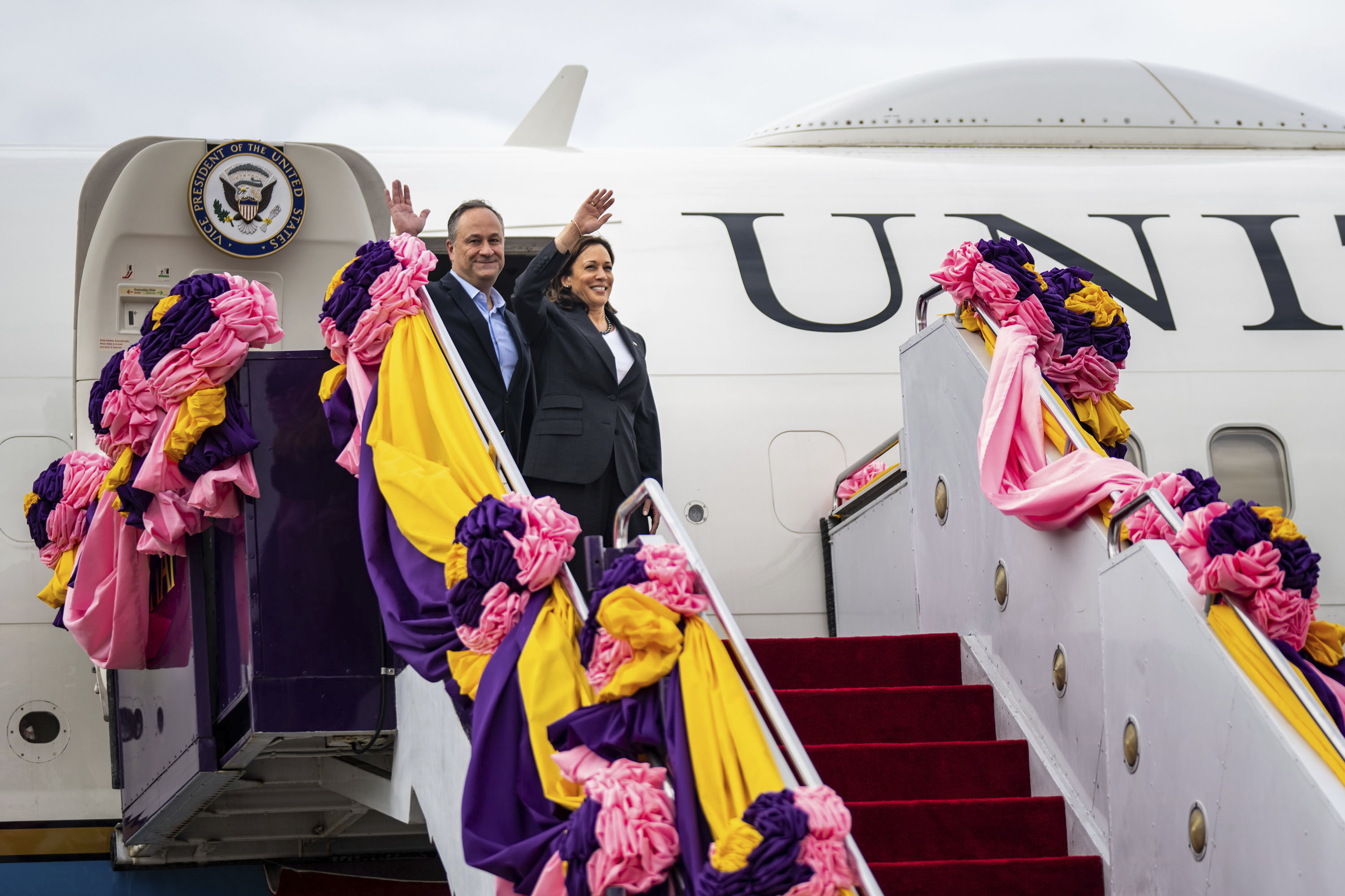 Vice President Kamala Harris and her husband Doug Emhoff wave before departing Don Mueang International Airport in Bangkok, Thailand, en route to the Philippines on Sunday.