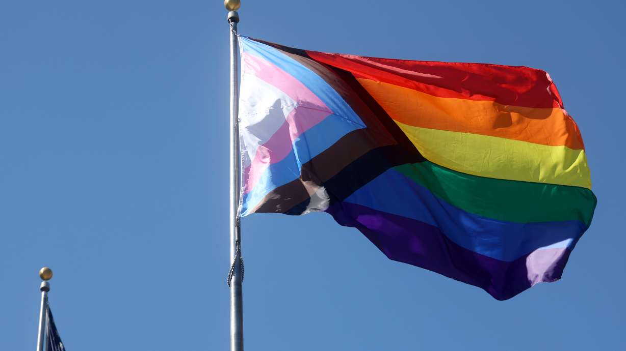 The Progress Pride flag waves in the wind after a ceremony to kick off Pride Month outside of the Salt Lake City-County Building on June 1. Utah Gov. Spencer Cox and other elected officials on Sunday called the shooting at a Colorado Springs gay nightclub that killed five and injured 18 the night before a 'senseless tragedy.'