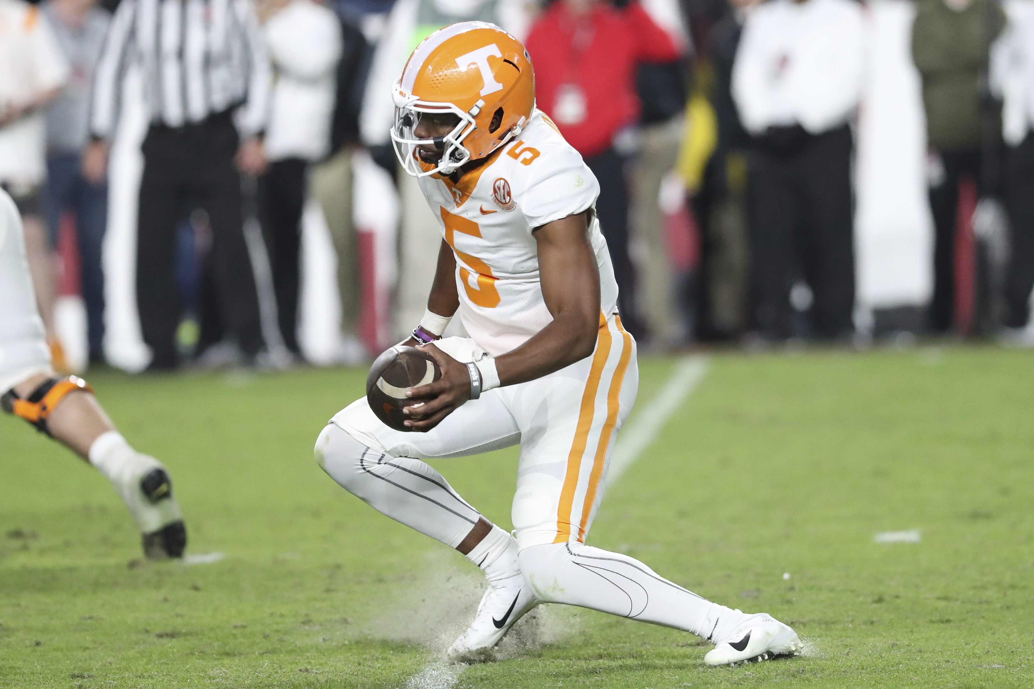 Tennessee quarterback Hendon Hooker suffers an injury while making a cut during the second half of the team's NCAA college football game against South Carolina on Saturday, Nov. 19, 2022, in Columbia, S.C. Hooker left the game. 