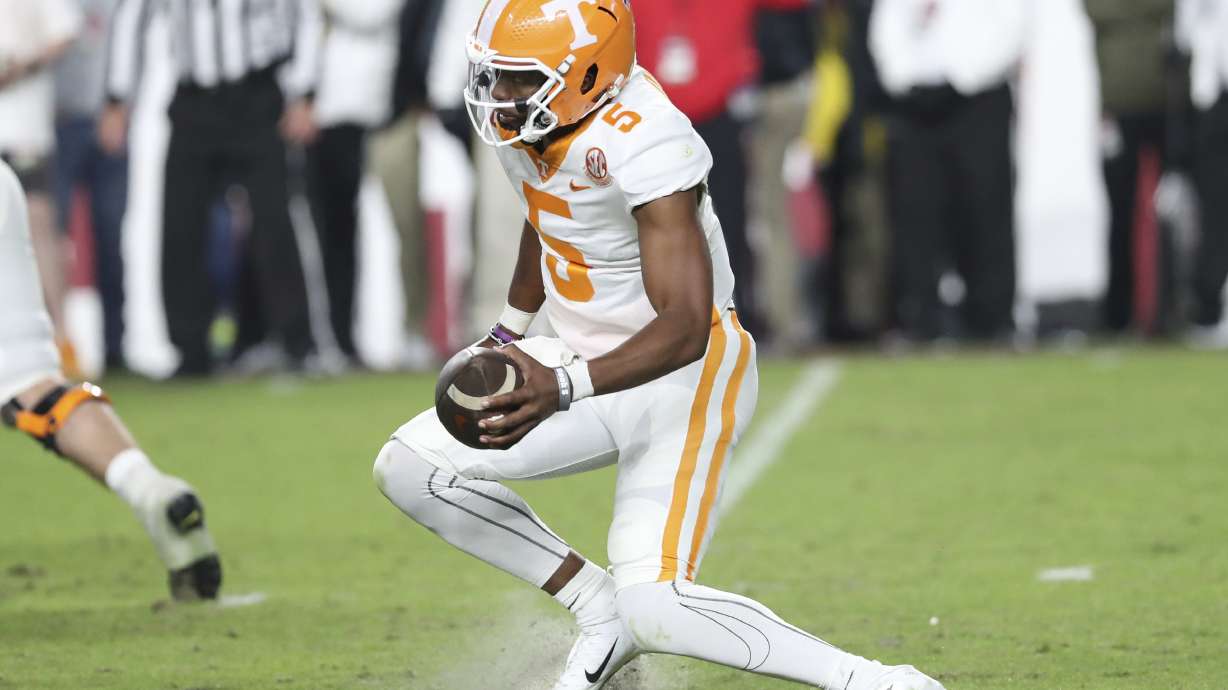 Tennessee quarterback Hendon Hooker suffers an injury while making a cut during the second half of the team's NCAA college football game against South Carolina on Saturday, Nov. 19, 2022, in Columbia, S.C. Hooker left the game.