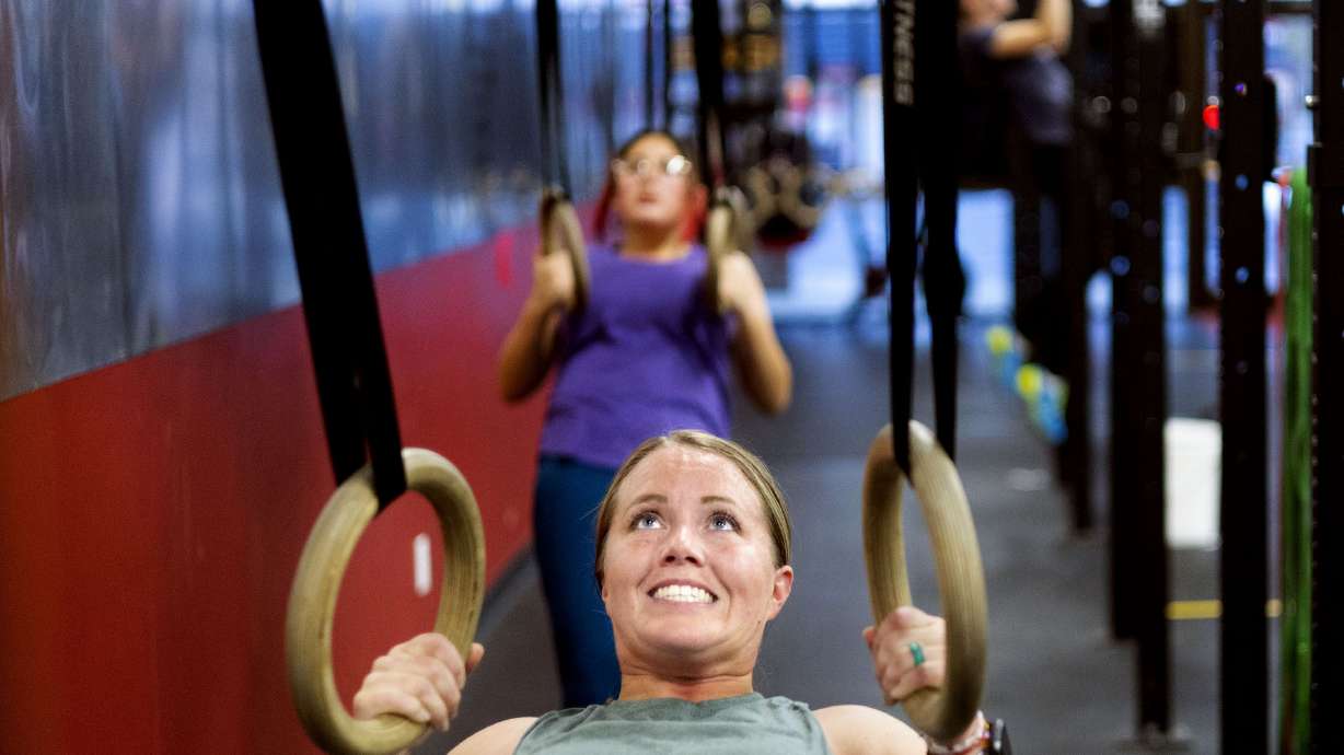 Jody Reid, a mother of three who reversed her Type 2 diabetes through exercise and diet, participates in a fitness class at Roy CrossFit in Roy on Nov. 9.