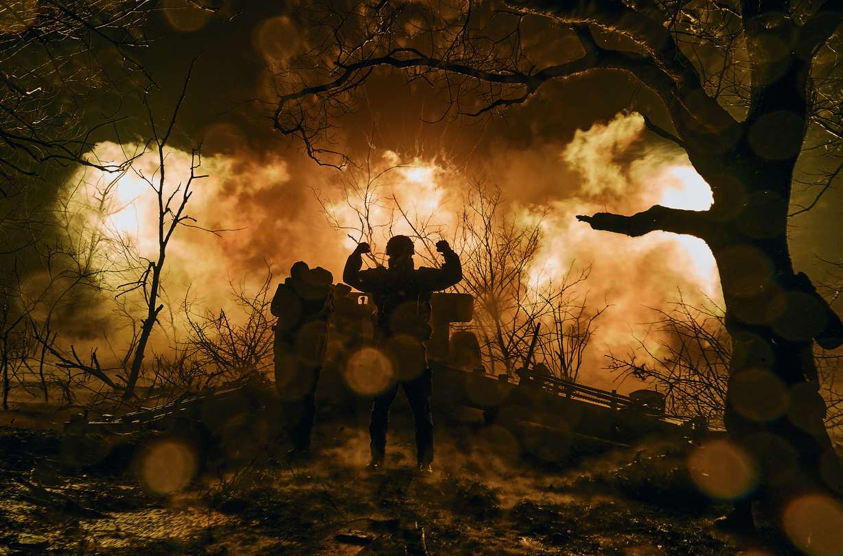 Ukrainian soldiers fire artillery at Russian positions near Bakhmut, Donetsk region, Ukraine, Sunday.