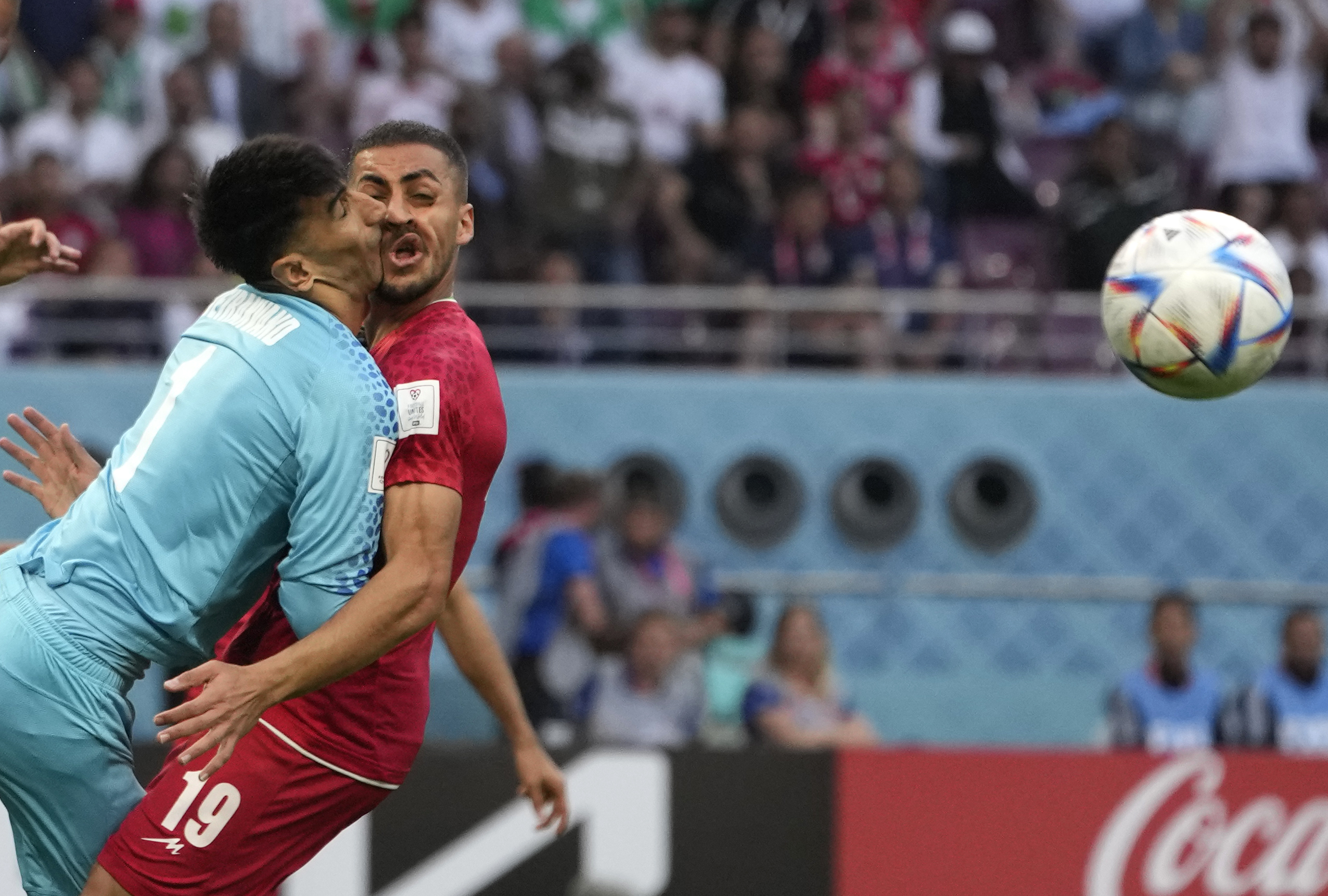 Iran's goalkeeper Alireza Beiranvand collides with Iran's Majid Hosseini, right, during the World Cup group B soccer match between England and Iran at the Khalifa International Stadium in Doha, Qatar, Monday, Nov. 21, 2022. 
