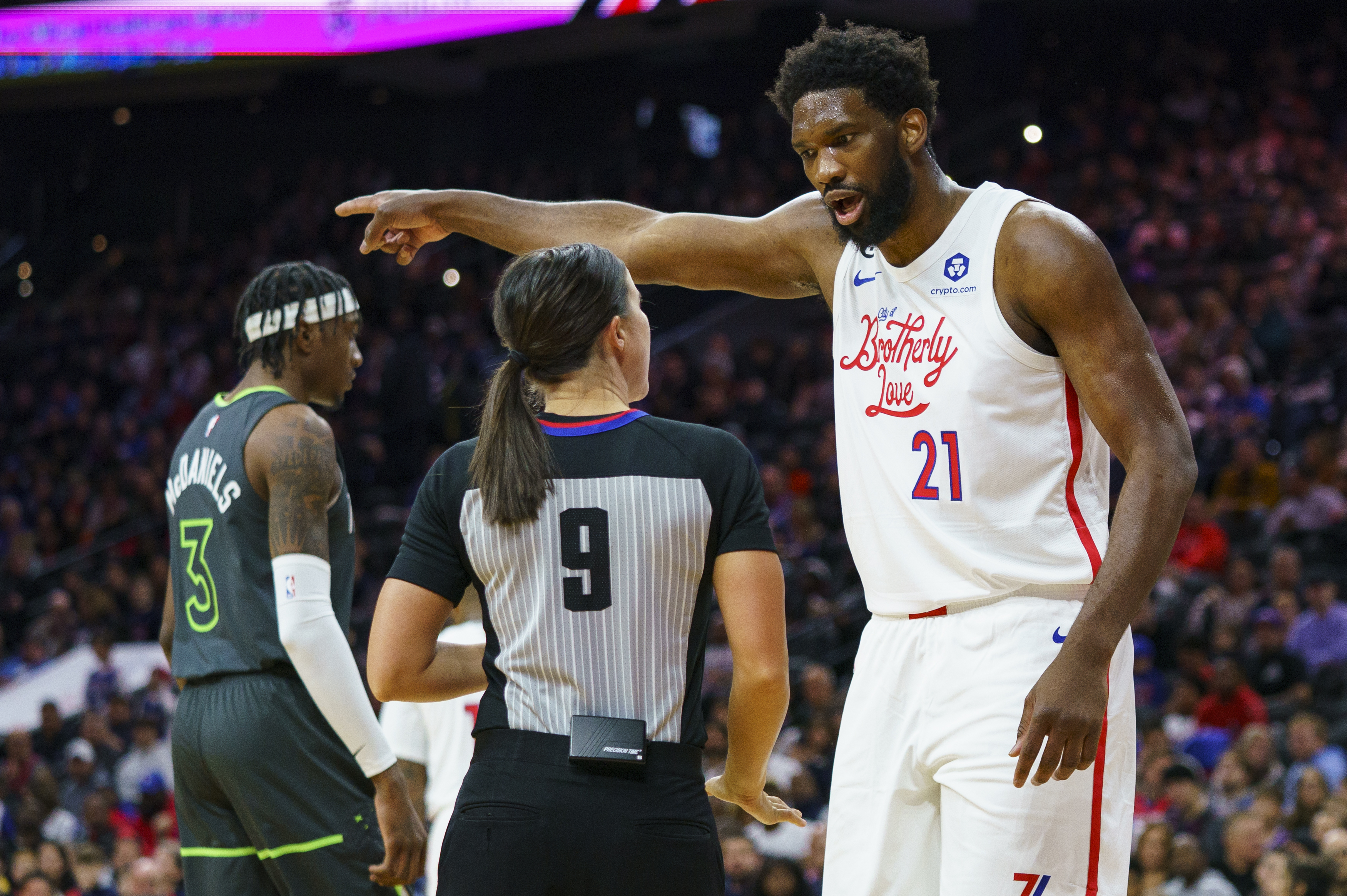 Philadelphia 76ers' Joel Embiid, right, reacts to a call by official Natalie Sago, center, during the first half of an NBA basketball game against the Minnesota Timberwolves, Saturday, Nov. 19, 2022, in Philadelphia. 
