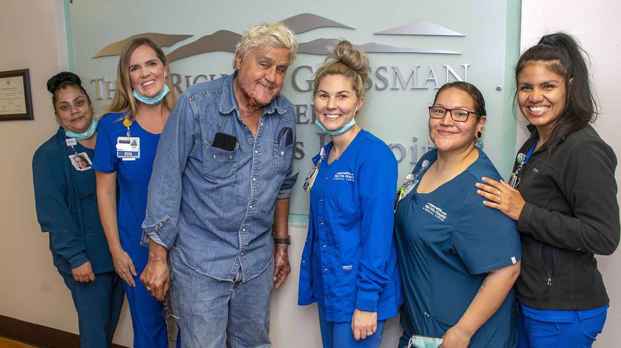 Jay Leno has been discharged from the hospital after sustaining burn injuries in a gasoline fire. Leno is seen here with the staff of the Grossman Burn Center on Monday.