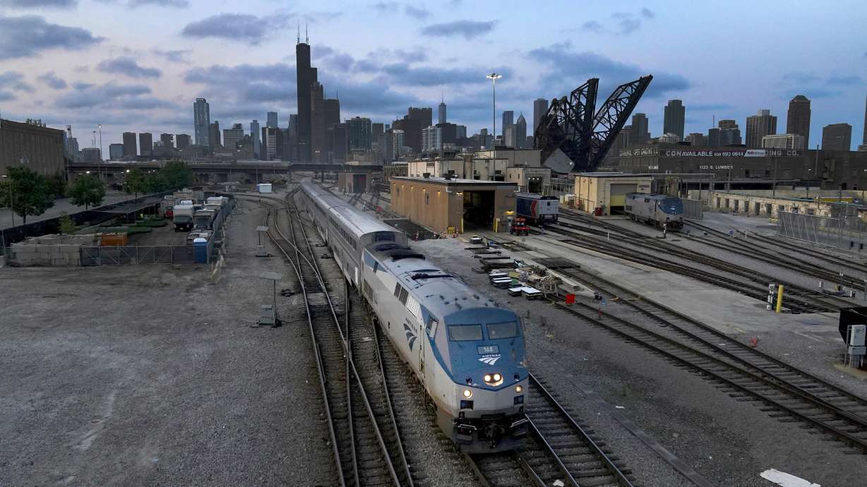 An Amtrak passenger train departs Chicago in the early evening headed south on Sept. 14 in Chicago. American consumers and nearly every industry will be affected if freight trains grind to a halt in December.