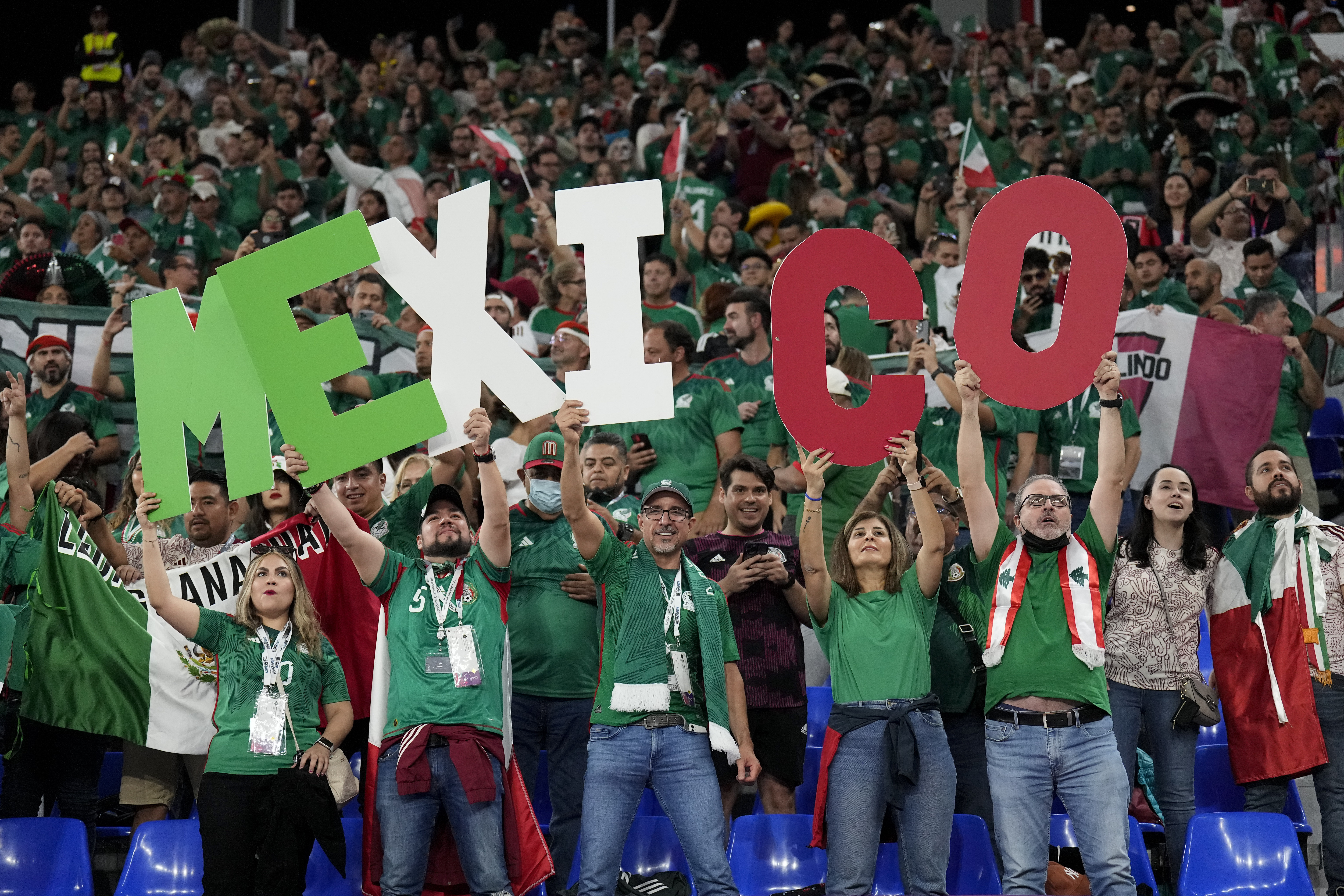 Fans of Mexico cheer during a World Cup group C soccer match against Poland at the Stadium 974 in Doha, Qatar, Tuesday, Nov. 22, 2022. 