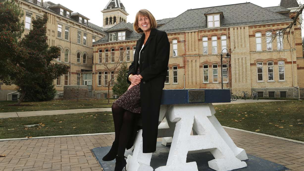 Utah State University President Noelle Cockett sits on the “block A” on the Logan campus on Nov 8, 2017. After six years of leading USU, Cockett on Tuesday announced that she will step down from her position on July 1.