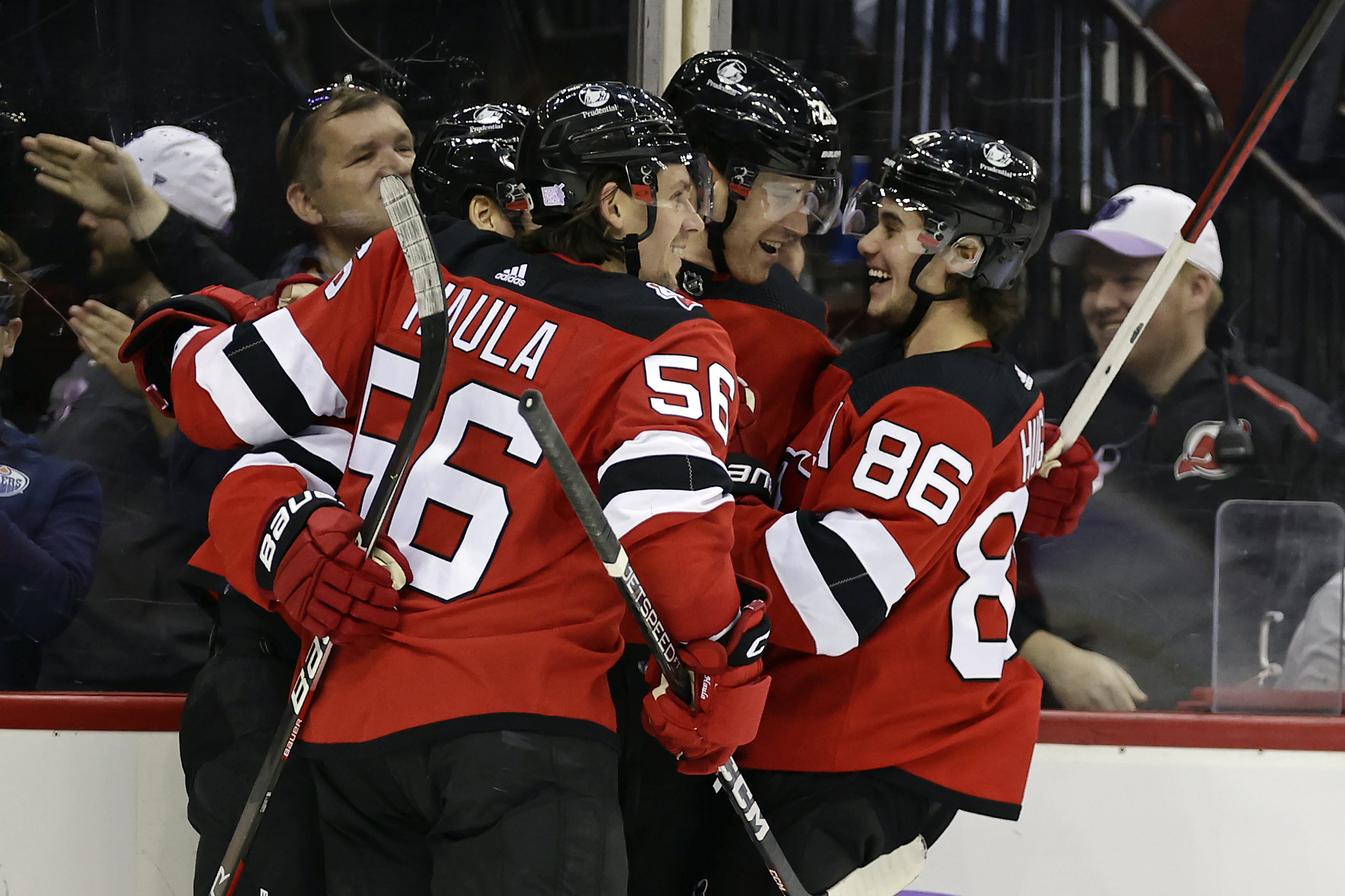 FILE - New Jersey Devils defenseman Damon Severson (28) celebrates with teammates after scoring a goal against the Edmonton Oilers during the second period of an NHL hockey game Monday, Nov. 21, 2022, in Newark, N.J. The New Jersey Devils cannot sneak up on teams anymore. The once-laughable also-rans have gone from a team that has missed the Stanley Cup playoffs nine of the last 10 years to currently the NHL's hottest team. 