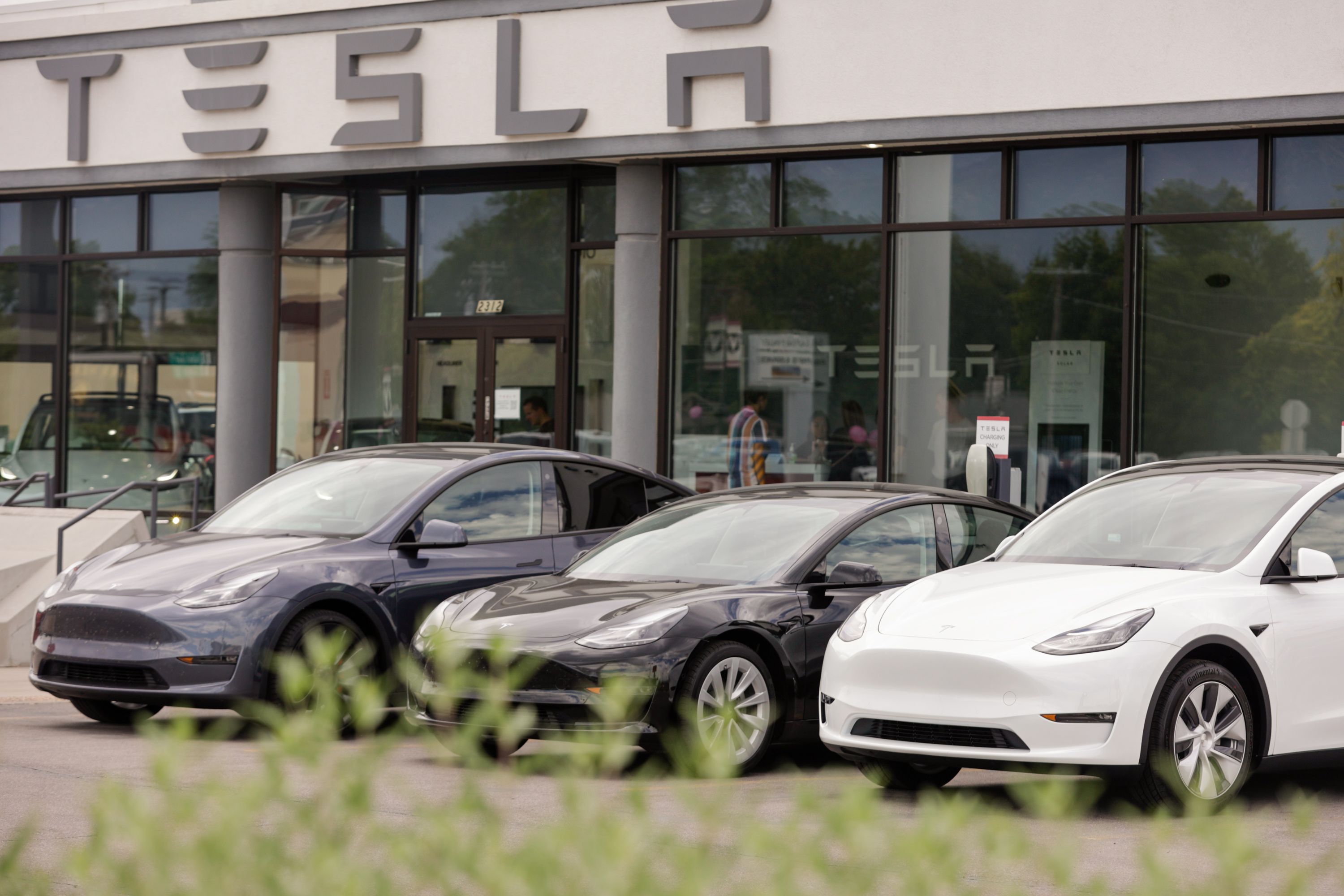 A row of Teslas sit parked outside a Tesla dealership in Provo on July 12. Tesla is having a no good very bad year as its stock has lost more than half its value so far in 2022, shaving tens of billions off owner Elon Musk's personal wealth.