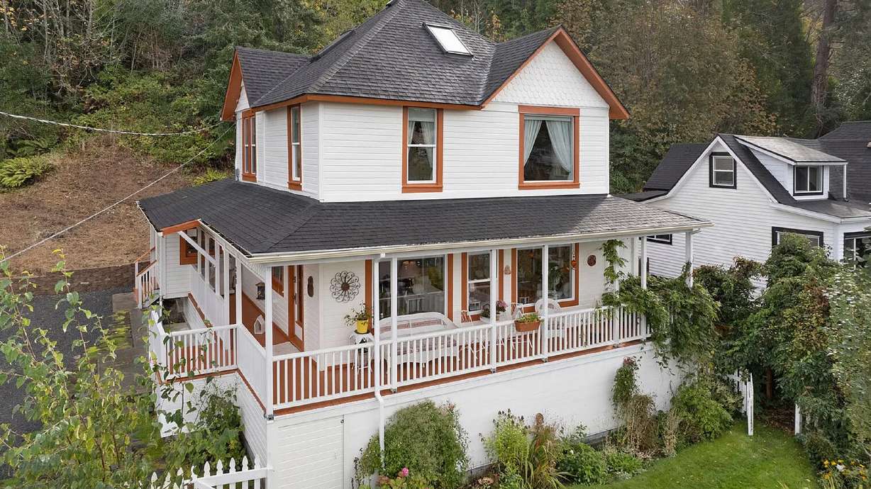 In this undated photo provided by RETO Media is the house featured in the Steven Spielberg film "The Goonies" in Astoria, Ore. The Victorian home, built in 1896 with sweeping views of the Columbia River as it flows into the Pacific Ocean, has been purchased by a fan.