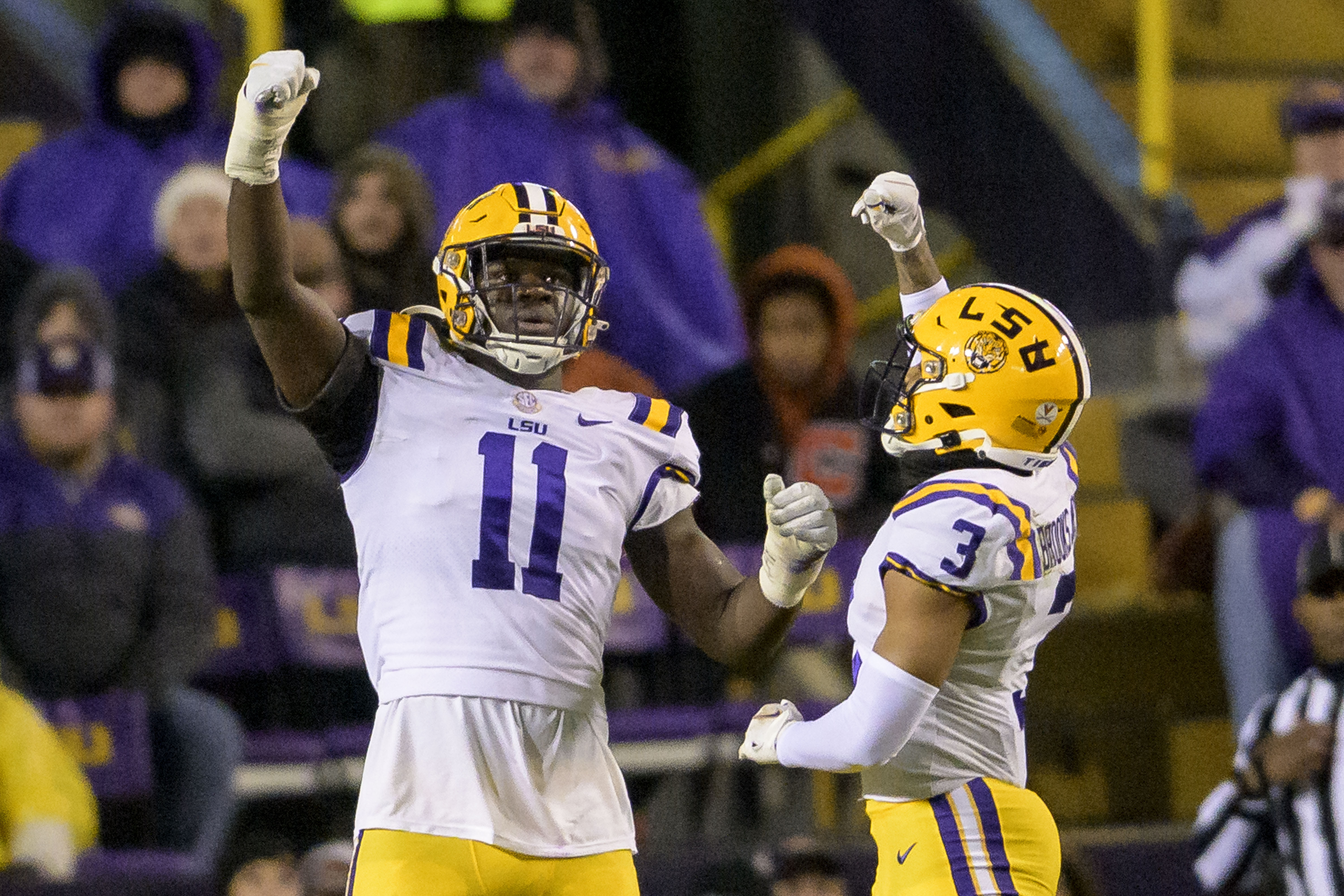 LSU defensive end Ali Gaye (11) celebrates a sack of UAB quarterback Dylan Hopkins with safety Greg Brooks Jr. (3) during the first half of an NCAA college football game in Baton Rouge, La., Saturday, Nov. 19, 2022.
