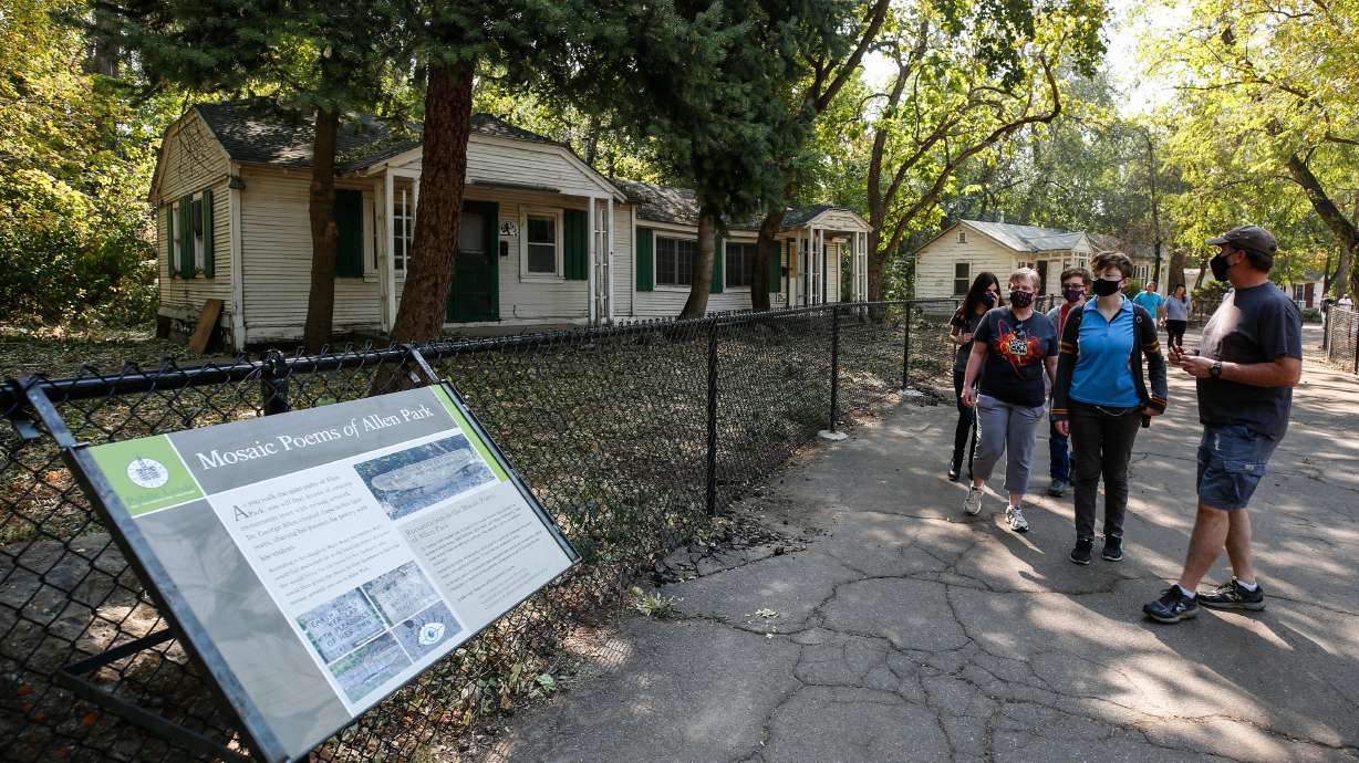 Visitors look at a historic wooden house while walking through Allen Park in Salt Lake City on Oct. 4, 2020. A project to improve the park is one of several items that will be funded through a general obligation bond that Salt Lake residents approved this month.