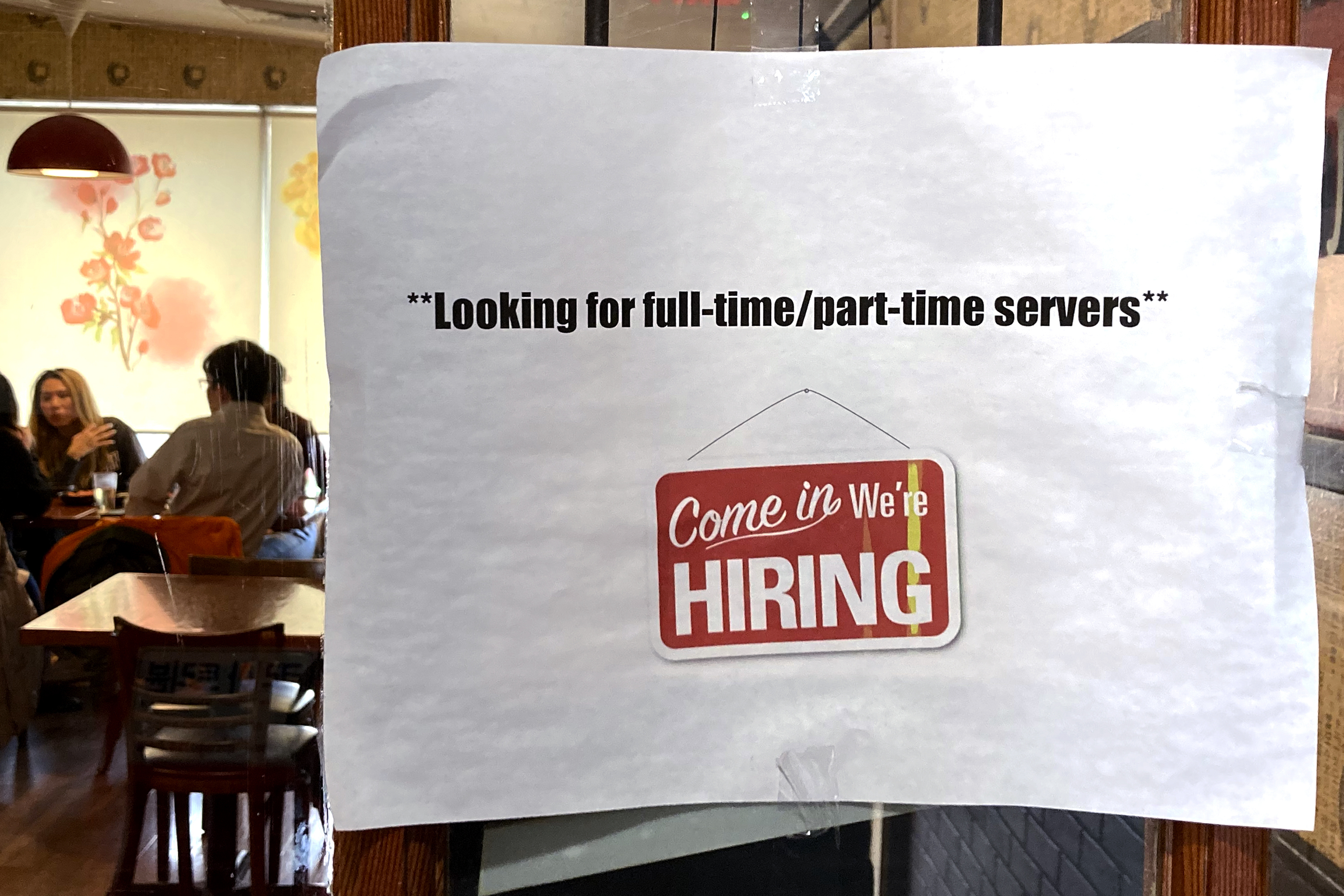 A hiring sign is displayed at a restaurant in Morton Grove, Ill., April 28. The number of Americans applying for unemployment benefits rose last week to the highest level since August but still remained low by historic standards, the Labor Department said Wednesday. 