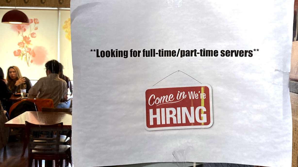 A hiring sign is displayed at a restaurant in Morton Grove, Ill., April 28. The number of Americans applying for unemployment benefits rose last week to the highest level since August but still remained low by historic standards, the Labor Department said Wednesday.