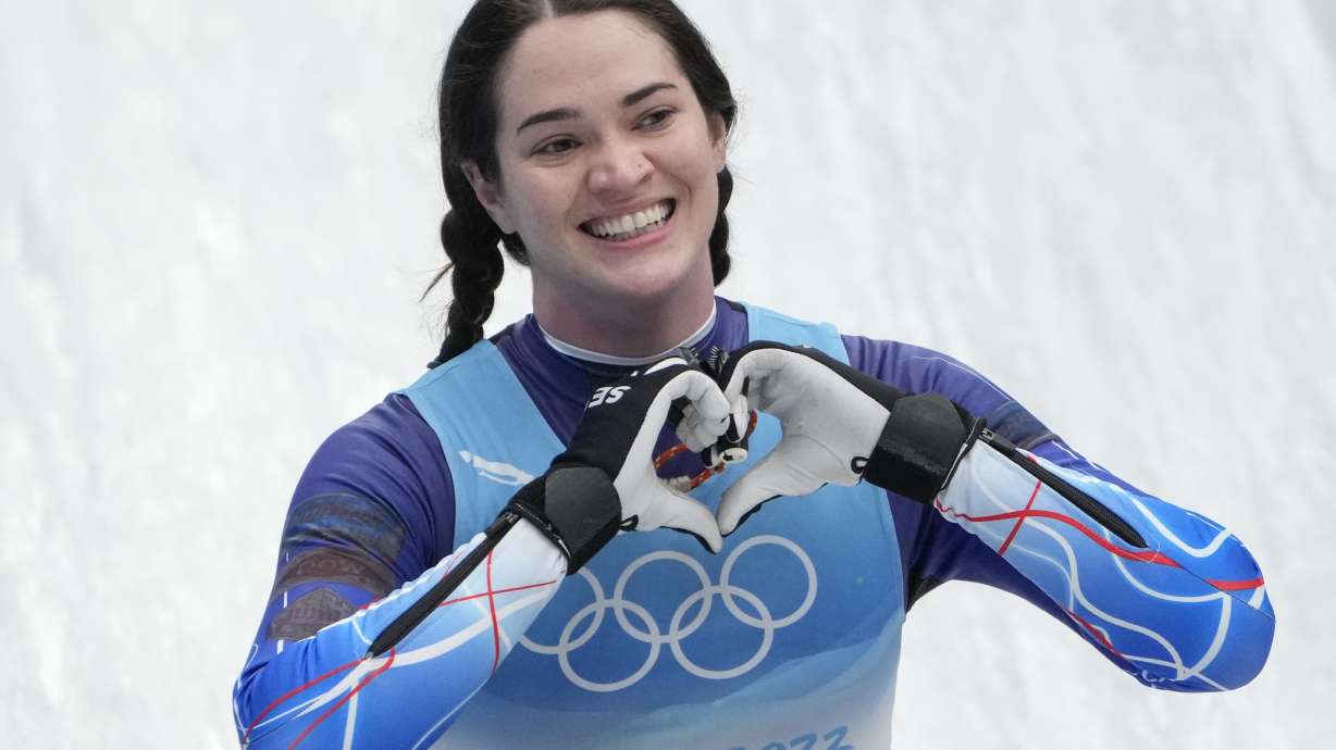 FILE - Summer Britcher, of the United States, finishes the luge women's singles run 3 at the 2022 Winter Olympics, Tuesday, Feb. 8, 2022, in the Yanqing district of Beijing. Summer Britcher and Emily Sweeney have been USA Luge teammates for years. They’ve traveled together, they’ve competed together, they’ve gone to the Olympics together, they’ve stood on World Cup podiums together. Being on a sled together was not part of the plan.