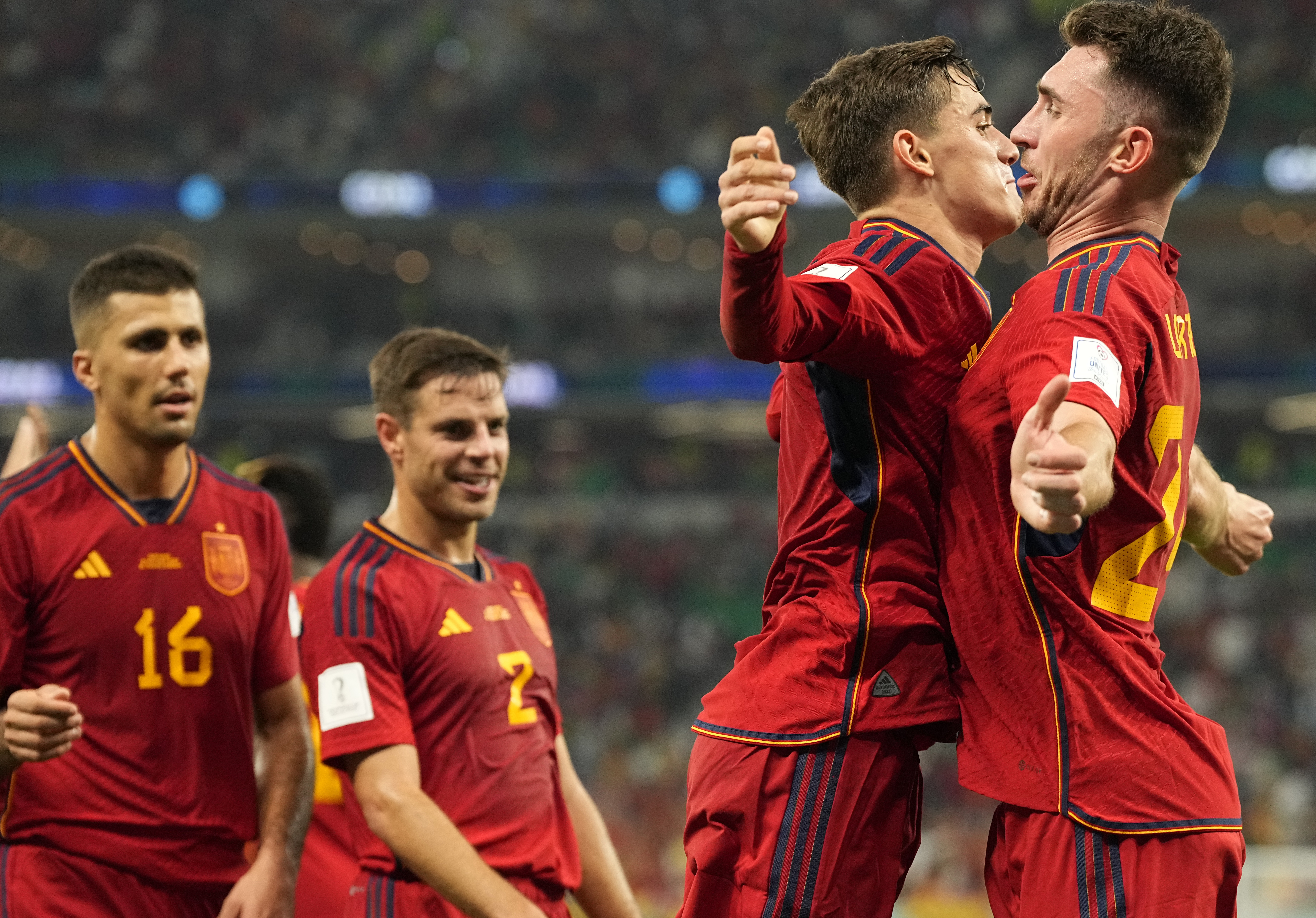 Spain's Gavi, second right, celebrates with Aymeric Laporte after scoring his side's fifth goal during the World Cup group E soccer match between Spain and Costa Rica, at the Al Thumama Stadium in Doha, Qatar, Wednesday, Nov. 23, 2022. 