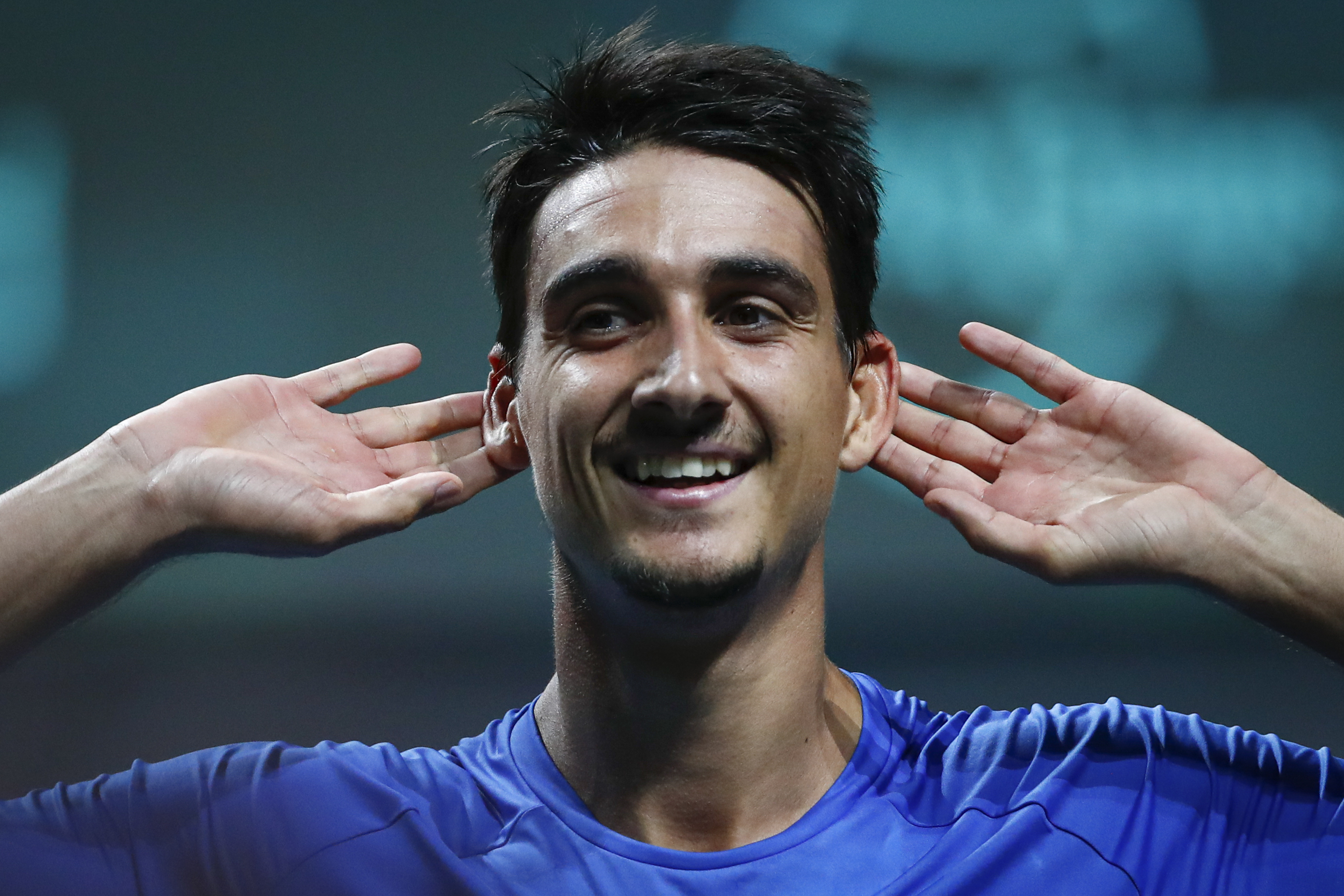 Italy's Lorenzo Sonego celebrates after defeating Frances Tiafoe of the USA during a Davis Cup quarter-final tennis match between Italy and USA in Malaga, Spain, Thursday, Nov. 24, 2022.