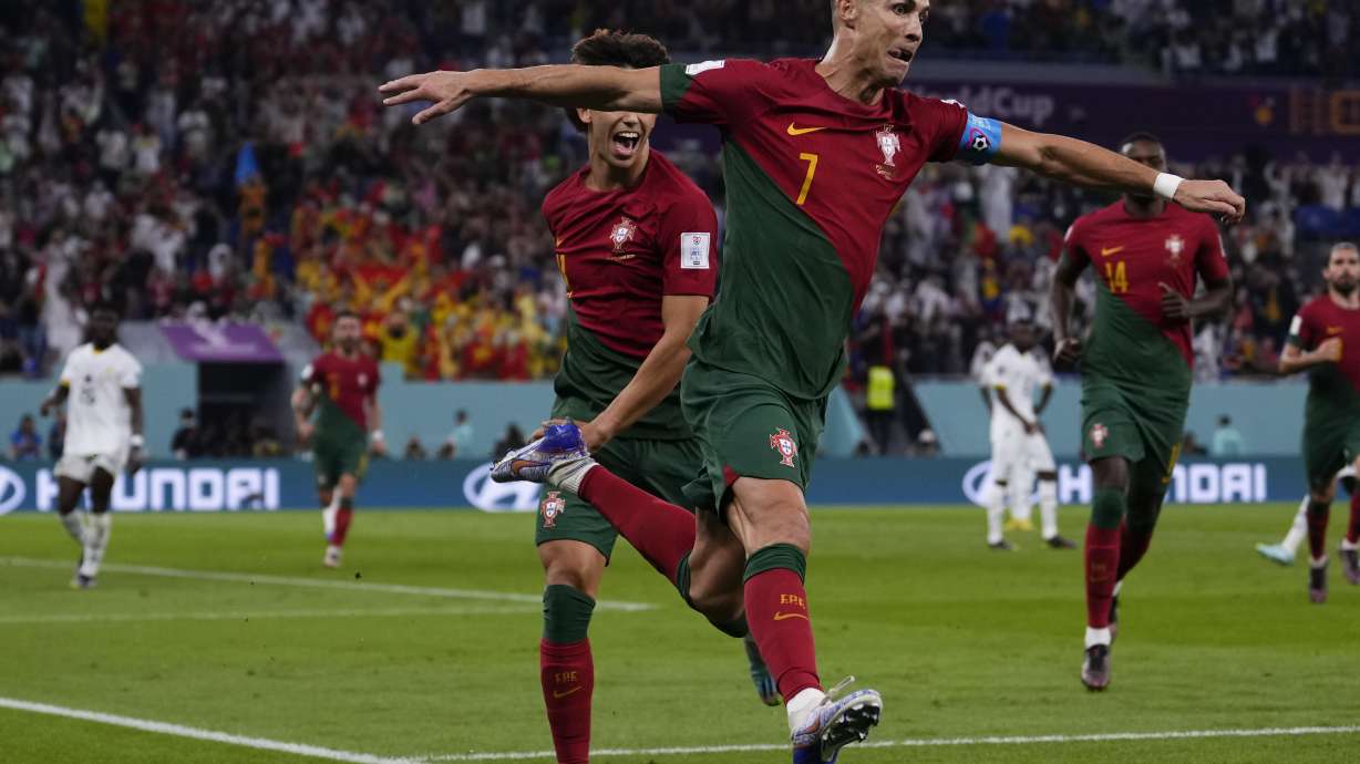 Portugal's Cristiano Ronaldo celebrates after scoring from the penalty spot his side's opening goal against Ghana during a World Cup group H soccer match at the Stadium 974 in Doha, Qatar, Thursday, Nov. 24, 2022.