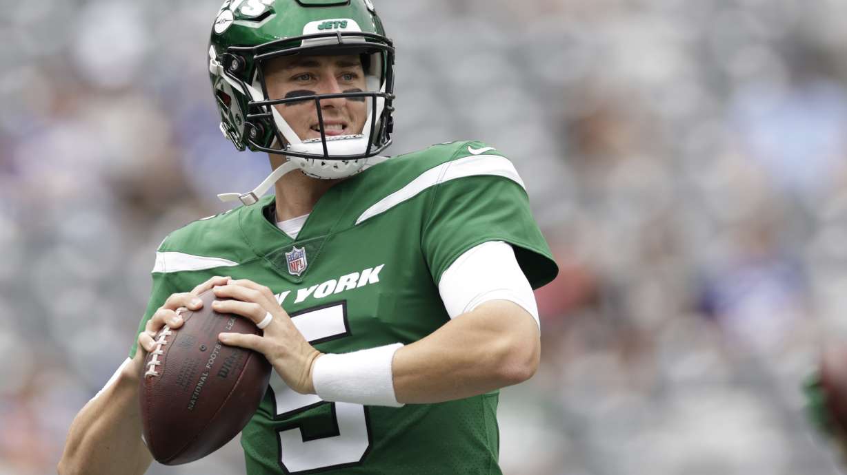 FILE - New York Jets quarterback Mike White (5) practices before a preseason NFL football game against the New York Giants, Sunday, Aug. 28, 2022, in East Rutherford, N.J. Zach Wilson has been benched by the New York Jets and will be replaced by Mike White as the starter Sunday against the Chicago Bears. Coach Robert Saleh announced the decision Wednesday, Nov. 23, after evaluating and discussing the situation with his assistants.
