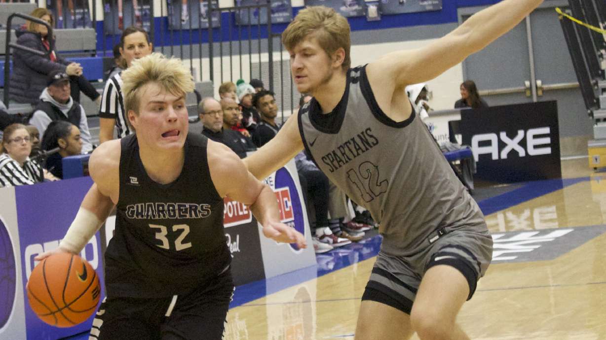 Corner Canyon guard Max Toombs drives during Chargers' 88-63 win over Bisho Walsh (Md.) in the 5 For The Fight National Hoopfest of Utah County, Wednesday, Nov. 23, 2022 at Pleasant Grove High School.