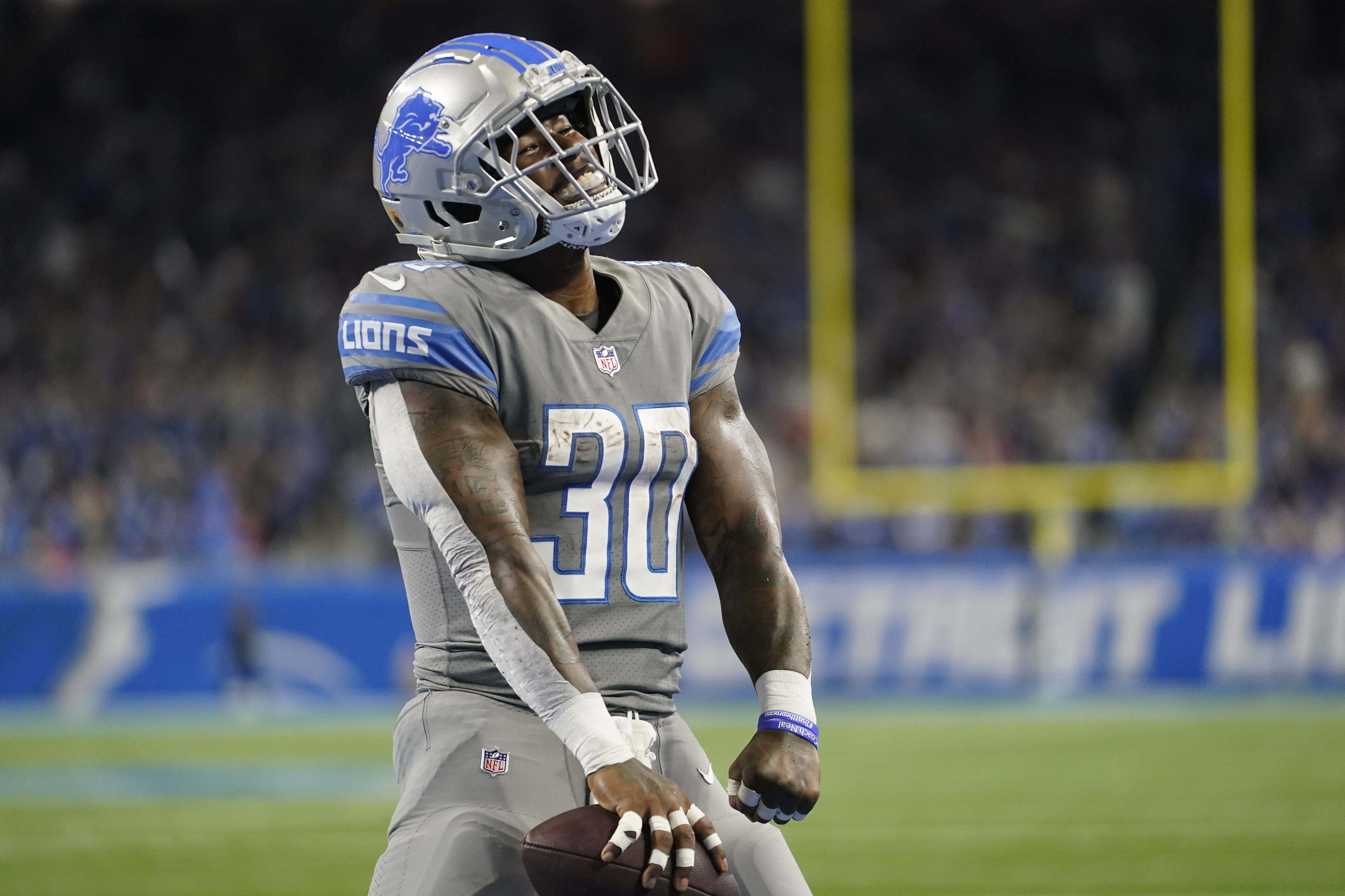 Detroit Lions running back Jamaal Williams reacts after his 2-yard rushing touchdown during the first half of an NFL football game against the Buffalo Bills, Thursday, Nov. 24, 2022. Williams scored his 17th touchdown of the season Sunday night in Green Bay, breaking Barry Sanders' 32-year-old franchise record with the Lions.