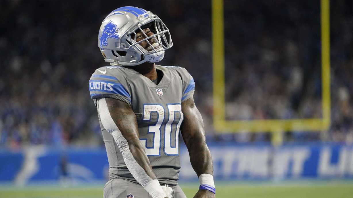 Detroit Lions running back Jamaal Williams reacts after his 2-yard rushing touchdown during the first half of an NFL football game against the Buffalo Bills, Thursday, Nov. 24, 2022, in Detroit.