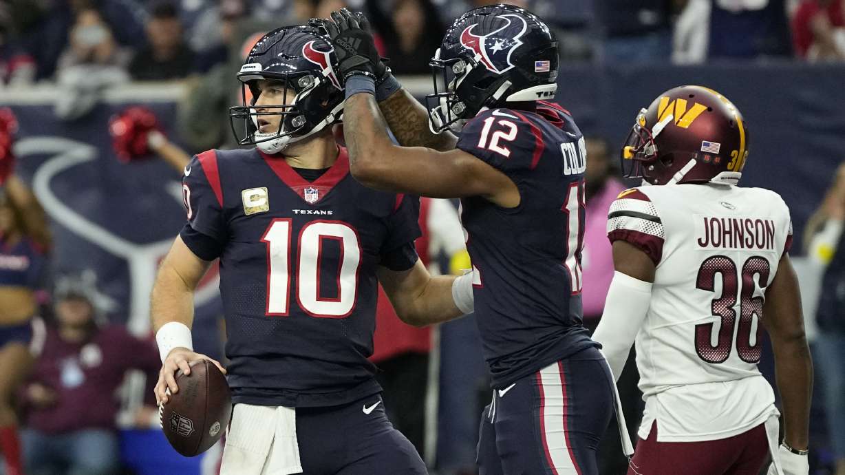Houston Texans quarterback Davis Mills (10) celebrates his touchdown run with teamamte Nico Collins (12) during the second half of an NFL football game Sunday, Nov. 20, 2022, in Houston.