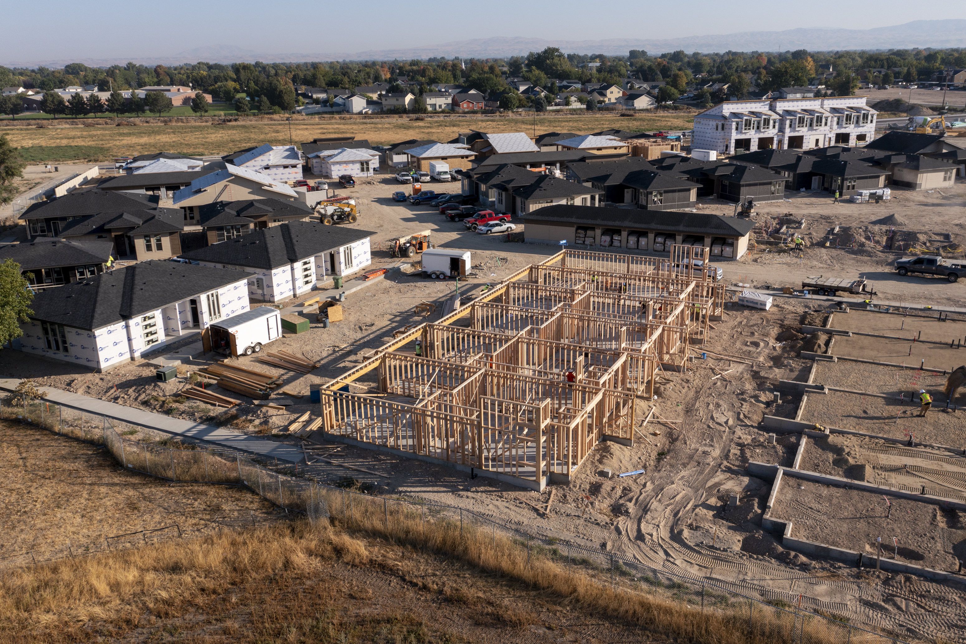 New homes are worked on in Meridian, Idaho, on Sept. 23. Homes sales prices have dropped in the West over the past few months, reports indicate.