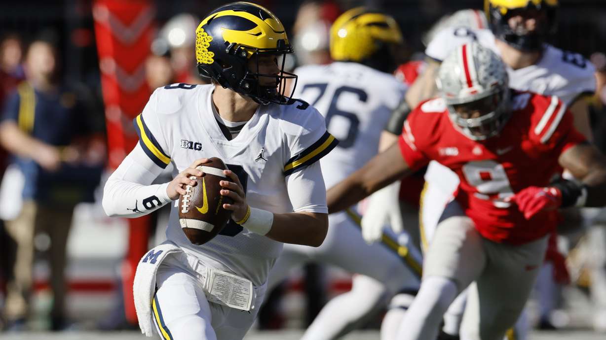 Michigan quarterback J.J. McCarthy drops back to pass against Ohio State during the first half of an NCAA college football game on Saturday, Nov. 26, 2022, in Columbus, Ohio.
