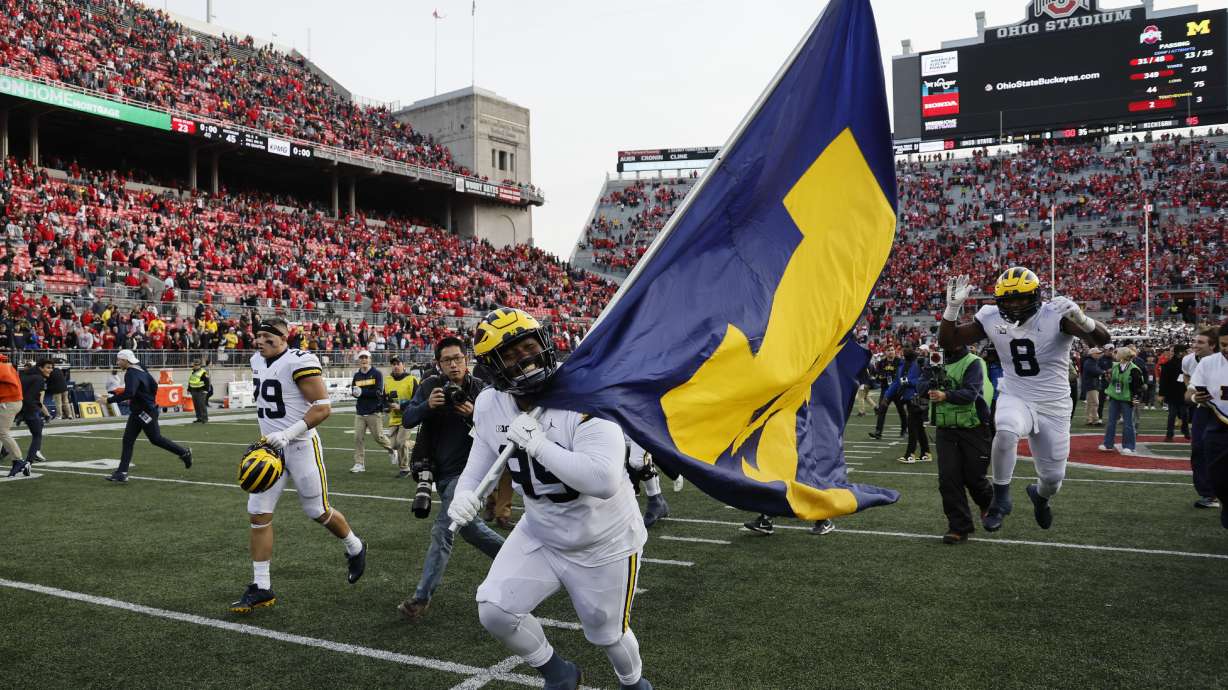Michigan defensive lineman Cam Goode celebrates their win over Ohio State after an NCAA college football game on Saturday, Nov. 26, 2022, in Columbus, Ohio.