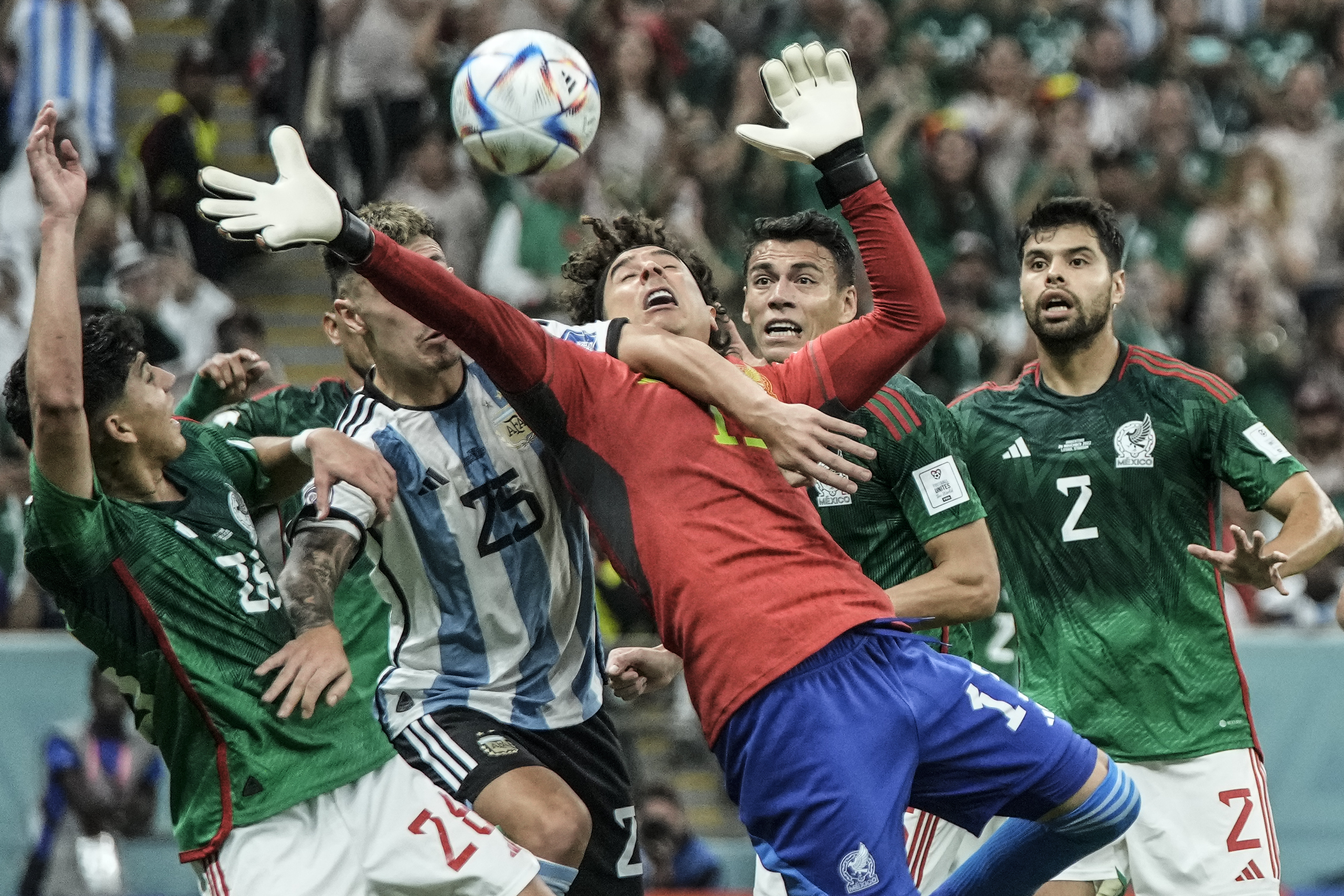 Mexico's goalkeeper Guillermo Ochoa goes for the ball during the World Cup group C soccer match between Argentina and Mexico, at the Lusail Stadium in Lusail, Qatar, Saturday, Nov. 26, 2022. 