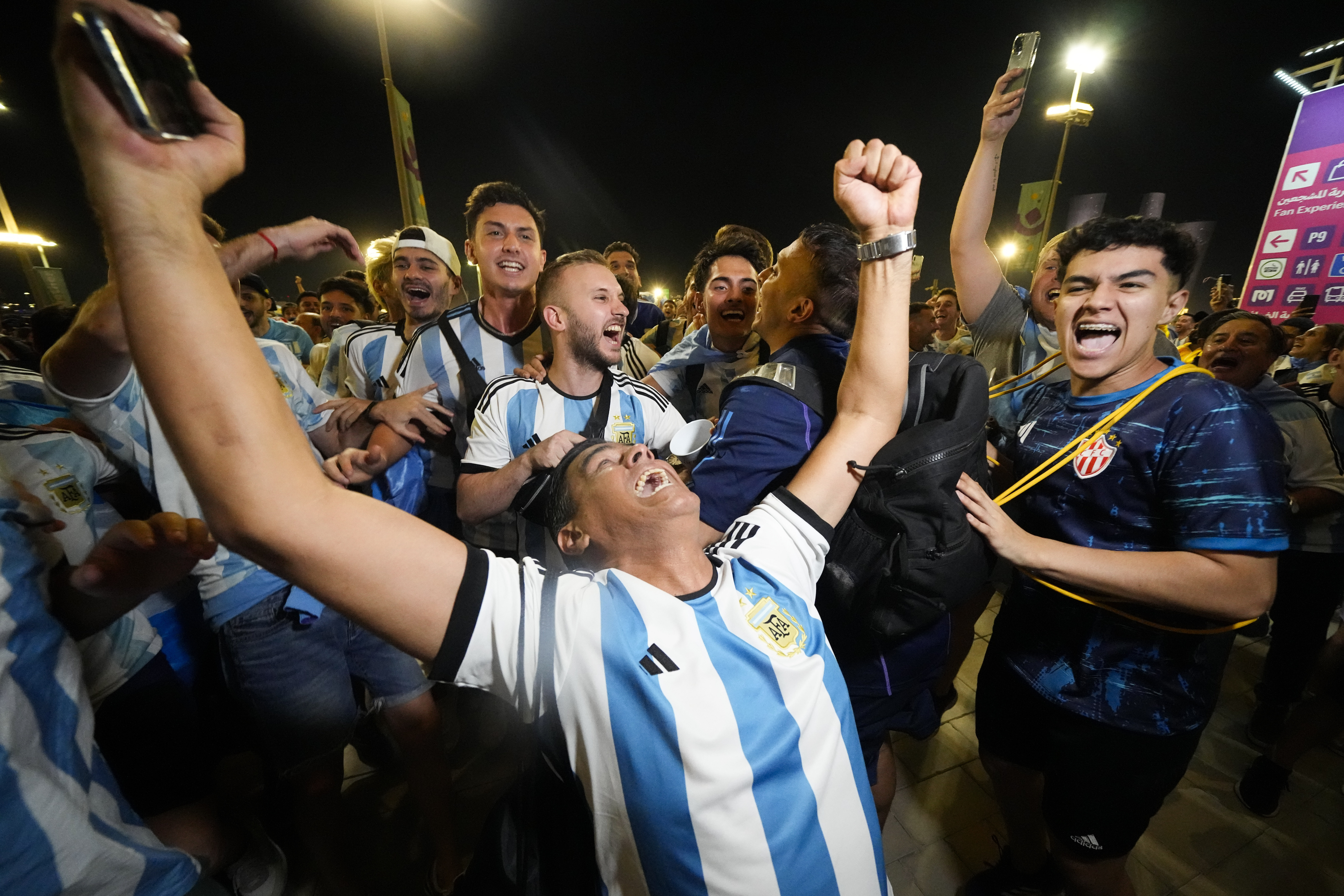 Supporters from Argentina celebrate outside Lusail Stadium following their team's 2-0 victory over Mexico in a World Cup group C soccer match in Lusail, Qatar, Saturday, Nov. 26, 2022.