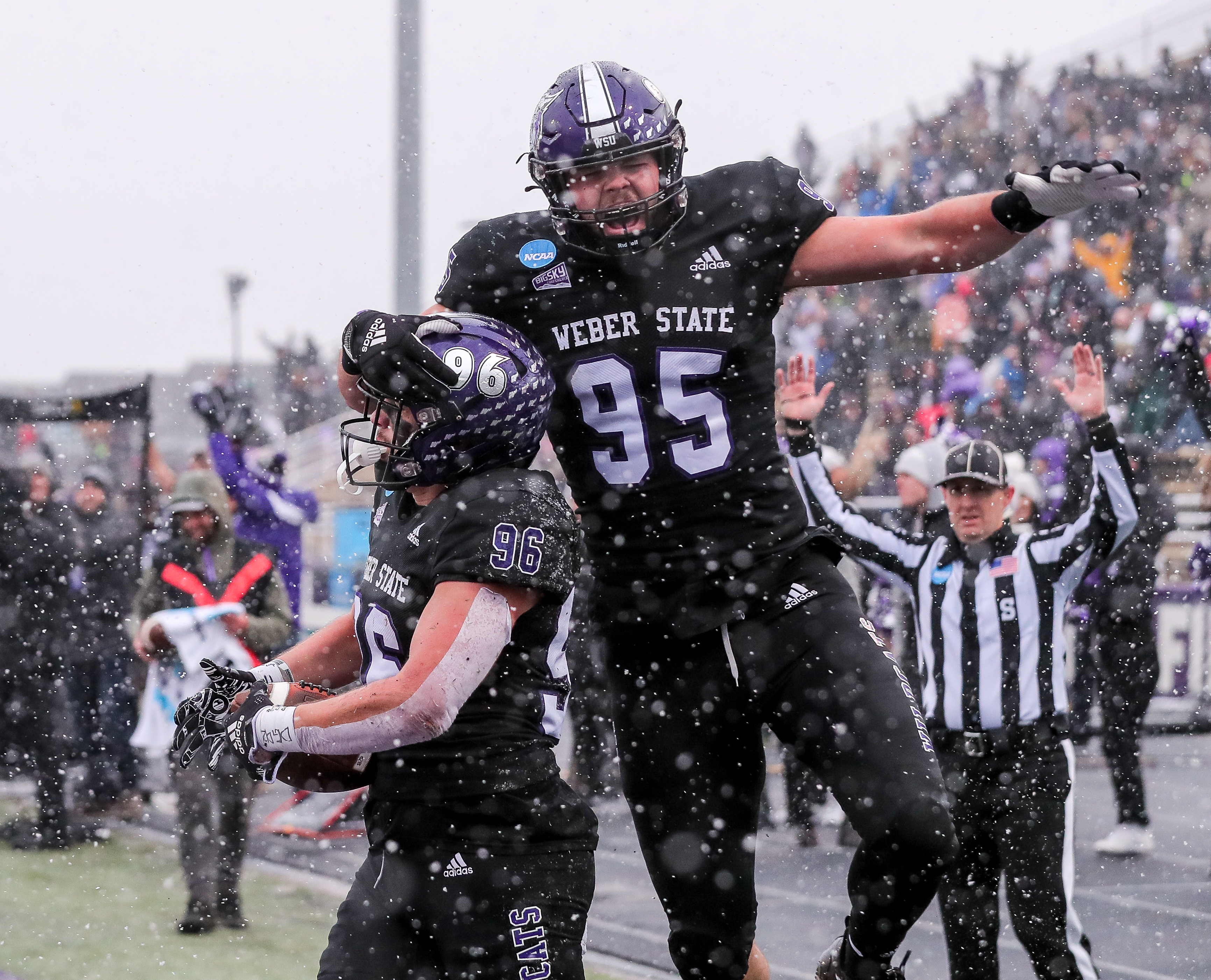 Tight end Davis Rasmussen (95) celebrates Hayden Meacham's (96) big touchdown catch in Weber State's first round playoff game against North Dakota on Nov. 26, 2022.